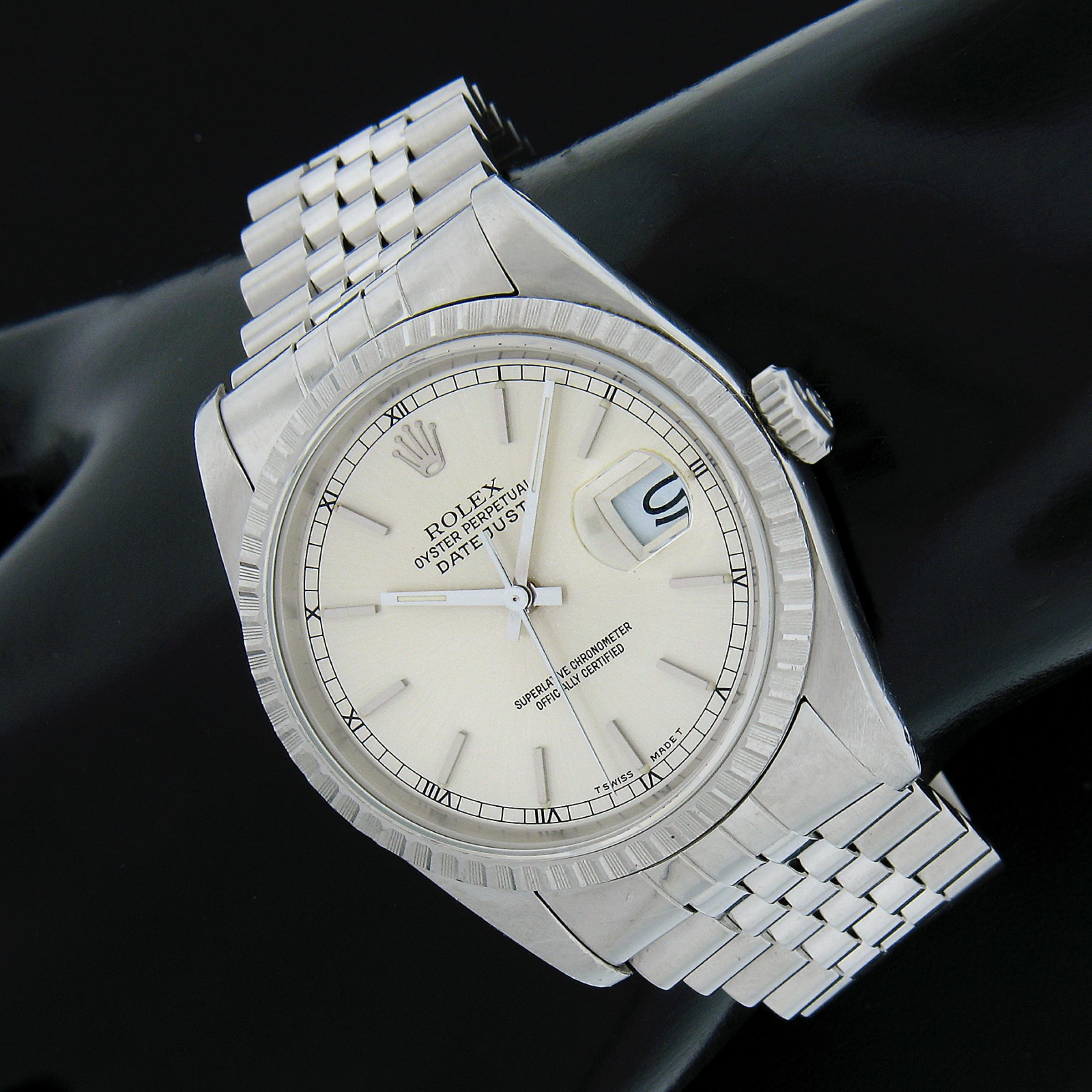 This classic unisex vintage Rolex Datejust wrist watch is circa 1989 and reference 16220. Features a classic silver dial, stainless steel jubilee bracelet and original engine turned style bezel. The automatic self-winding movement runs smoothly and