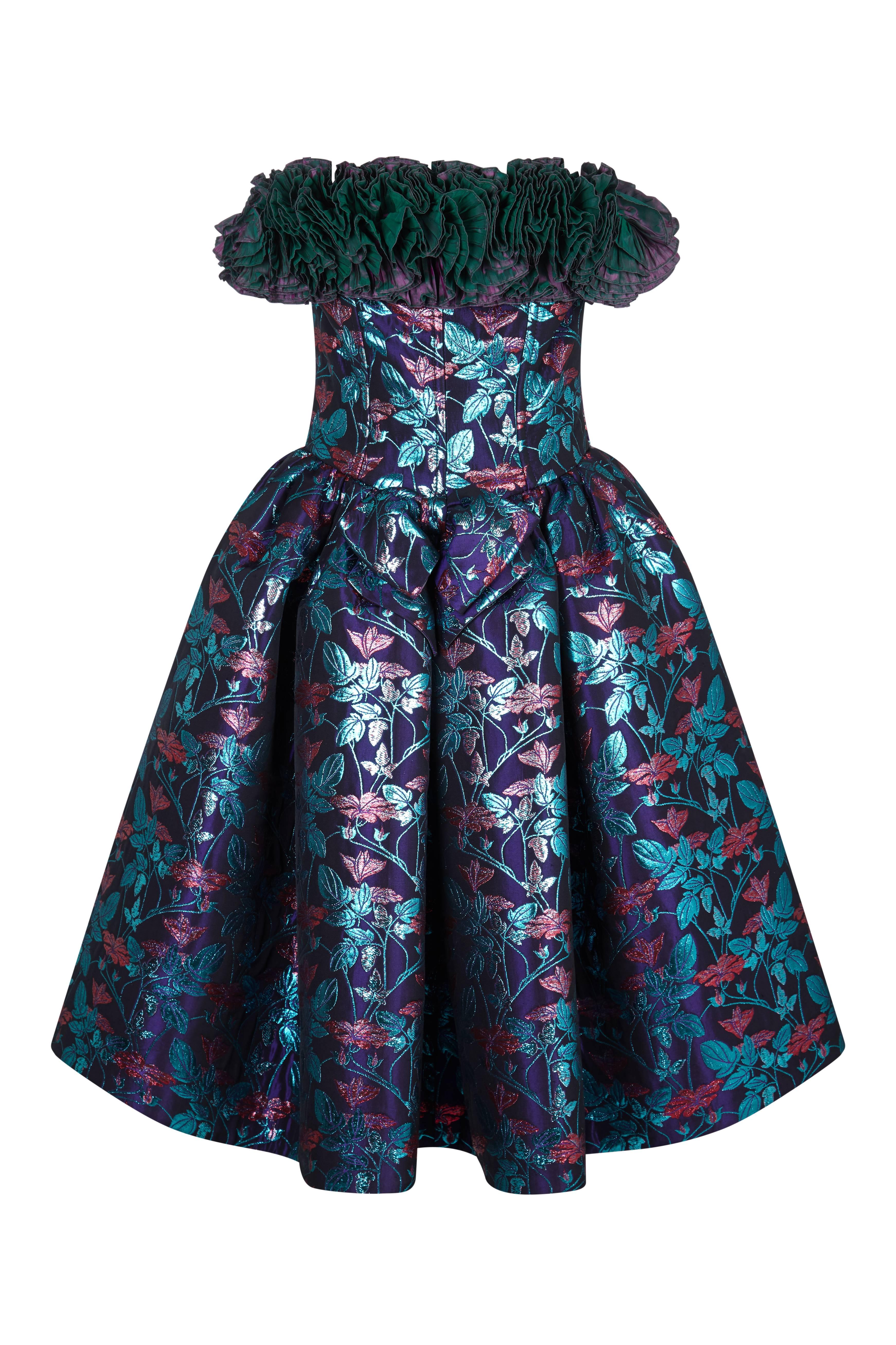 This incredible 1990s Nina Ricci haute couture party dress is a guaranteed show-stopper and boasts a striking array of design features synonymous with the uncompromising feminine glamour of this celebrated label. Lavish, deep purple lame fabric is