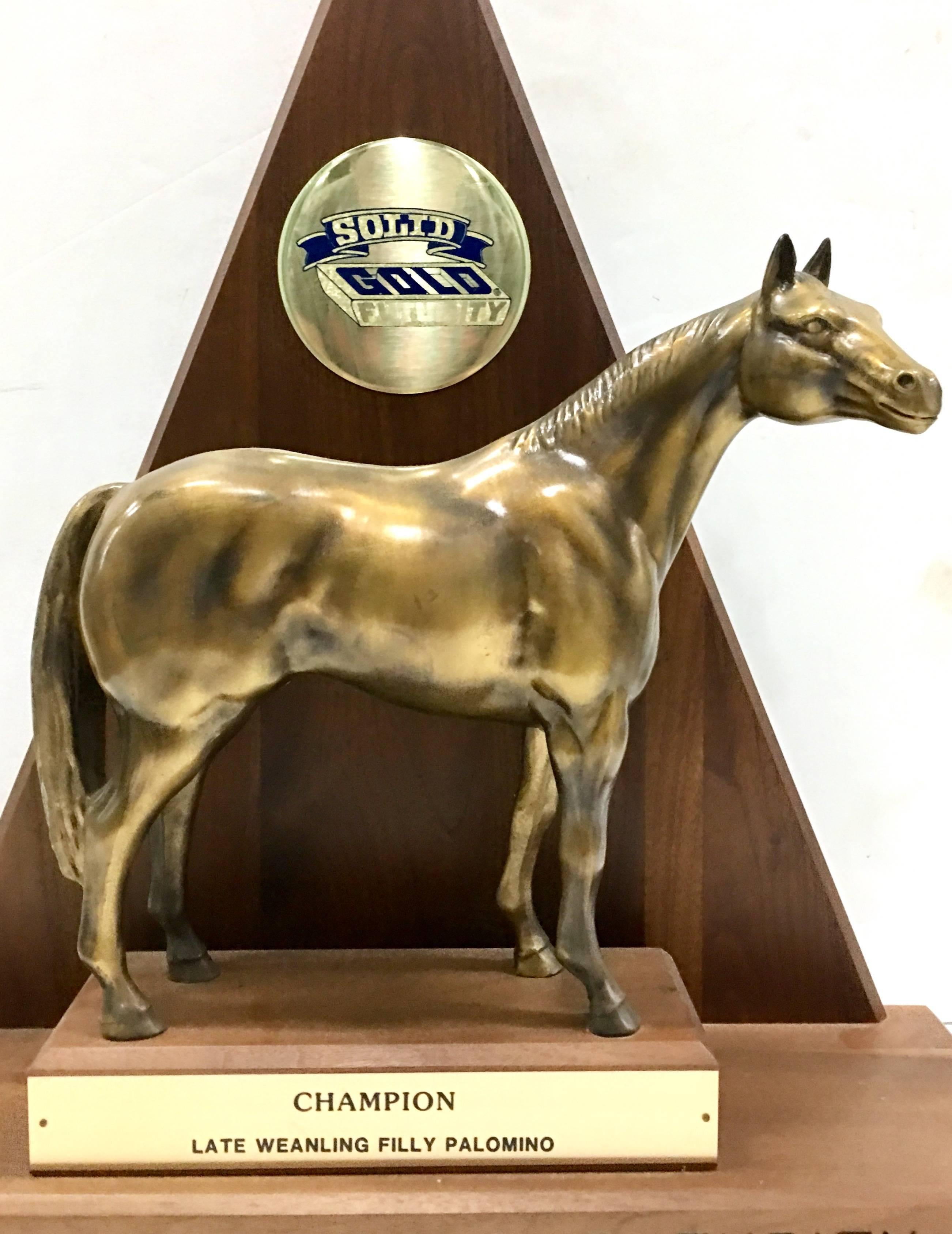 Solid brass and walnut mounted championship horse trophy, 1989. This 