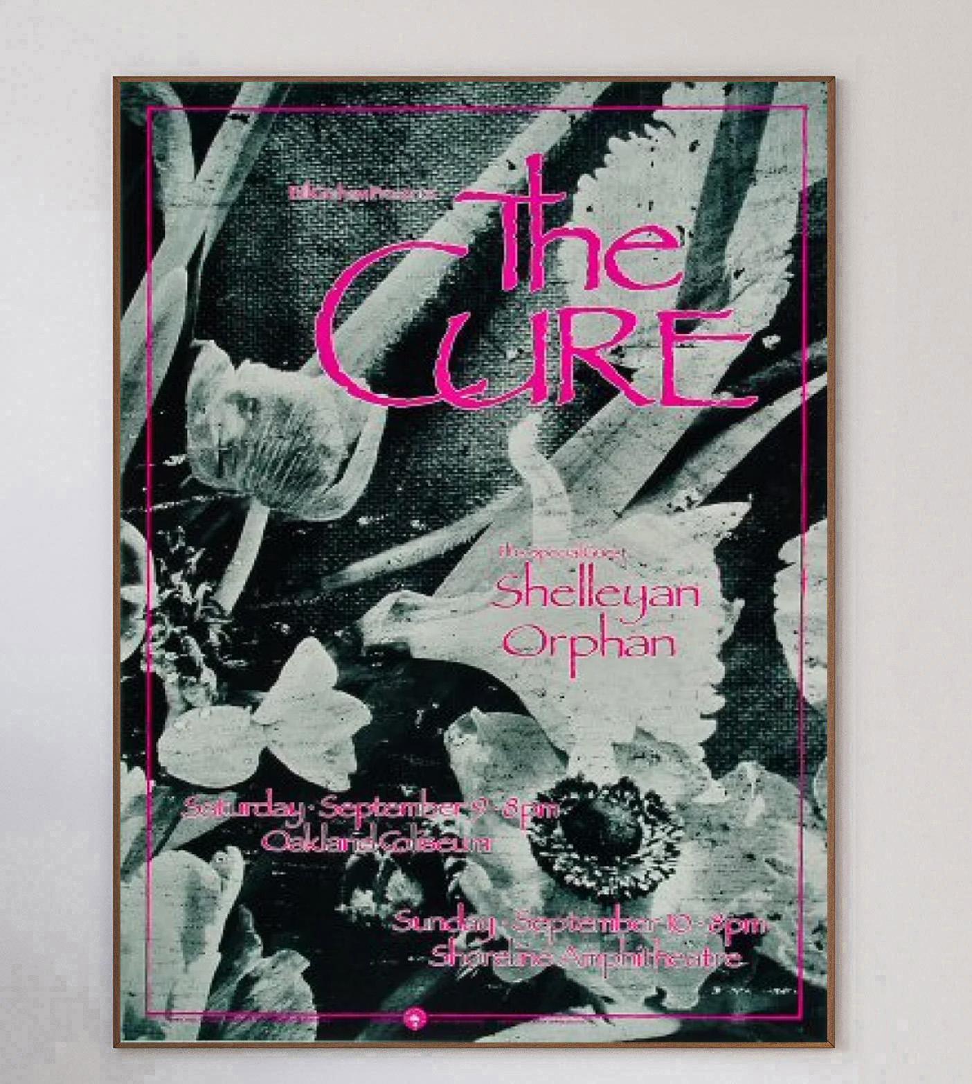 Designed by concert poster artist Arlene Owseichik, this beautiful poster was created in 1989 to promote a live concert of The Cure at the Oakland Coliseum in California. The show was part of the bands US tour in support of their legendary 1989