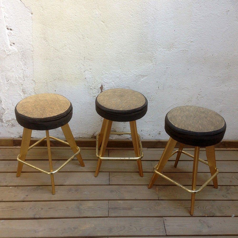 These casino stools were originally manufactured in 1989 in the United States for a gambling salon in New Jersey. They have a comfortable cushioned seat, upholstered in a dark black fabric on the sides and a wheat and gray speckled fabric on the