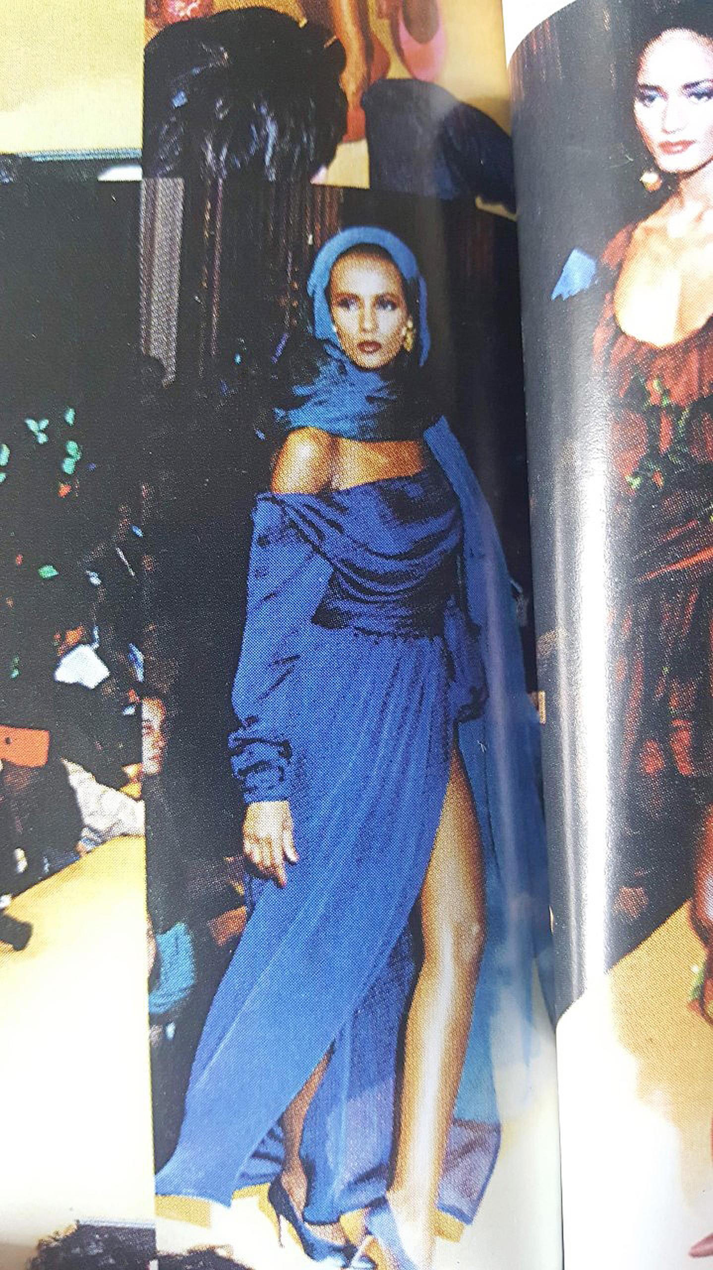 Breathtaking Yves Saint Laurent Haute-Couture gown from his iconic 1989 spring-summer documented collection. It is insanely chic with its fluid grecian goddess construction. The fabric is a luxurious cobalt-blue sheer sheer silk crepe complete with