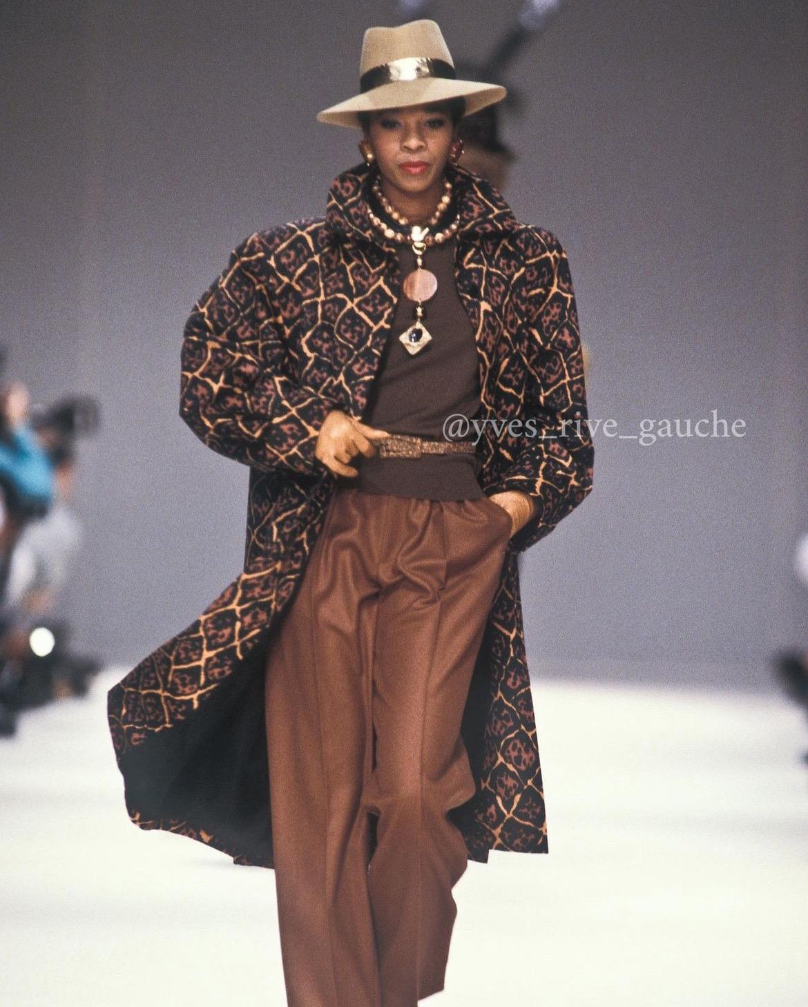 Chic Yves Saint Laurent leopard print cotton-twill trench jacket from the infamous Rive Gauche collection during spring-summer of 1989. Pieces from this collection are very rare and are true examples of fashion history. I adore the cuffed-sleeves