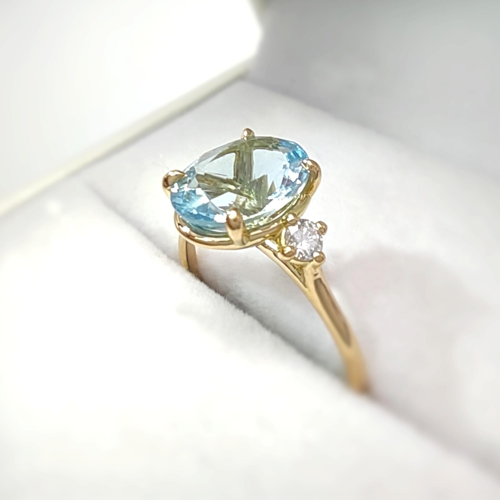 SIZE: US 7
Gemstone: Aquamarine:
- Shape: Oval
- Quantity: 1 piece
- Dimensions: Approximately 0.385 x 0.304 x 0.186 inches
- Weight: 1.98 carats

Diamonds:
- Type: Brilliant
- Quantity: 2 pieces
- Size: Approximately 0.098 x 0.098 inches each
-