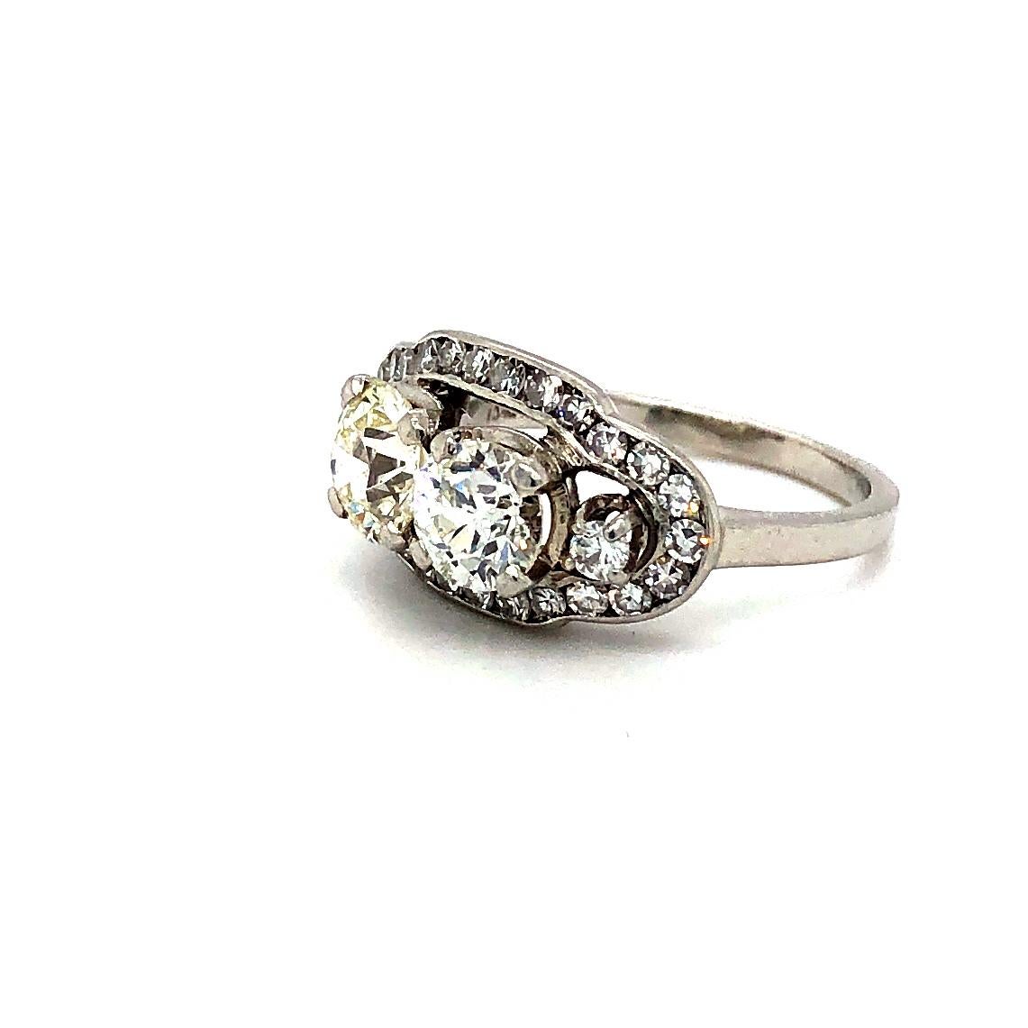 Offered here is a unusual vintage ladies diamond ring. The ring is platinum ( marked plat ) and is a finger size 4.75 but can be sized. The platinum ring weighs 6.0 grams and measures about 10.2 mm wide on top and graduates down to 1.75 mm on the