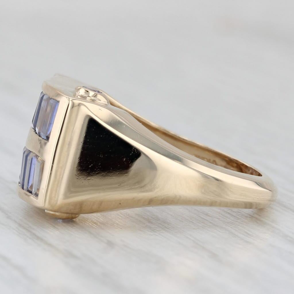 Gemstone Information:
- Natural Iolites -
Total Carats - 1.90ctw
Cut - Baguette
Color - Purple / Blue

- Natural Tanzanites -
Total Carats - 0.08ctw
Cut - Round 
Color - Purple
Treatment - Heated

Metal: 14k Yellow Gold 
Weight: 6.4 Grams 
Stamps: