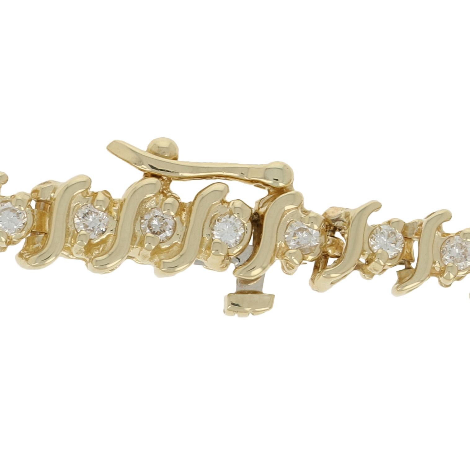 No matter the season, this exceptional piece will always dazzle! This 14k yellow gold tennis bracelet showcases white diamonds set between gracefully curved gold bars for the perfect balance of sparkle and shine. 

Metal Content: Guaranteed 14k Gold