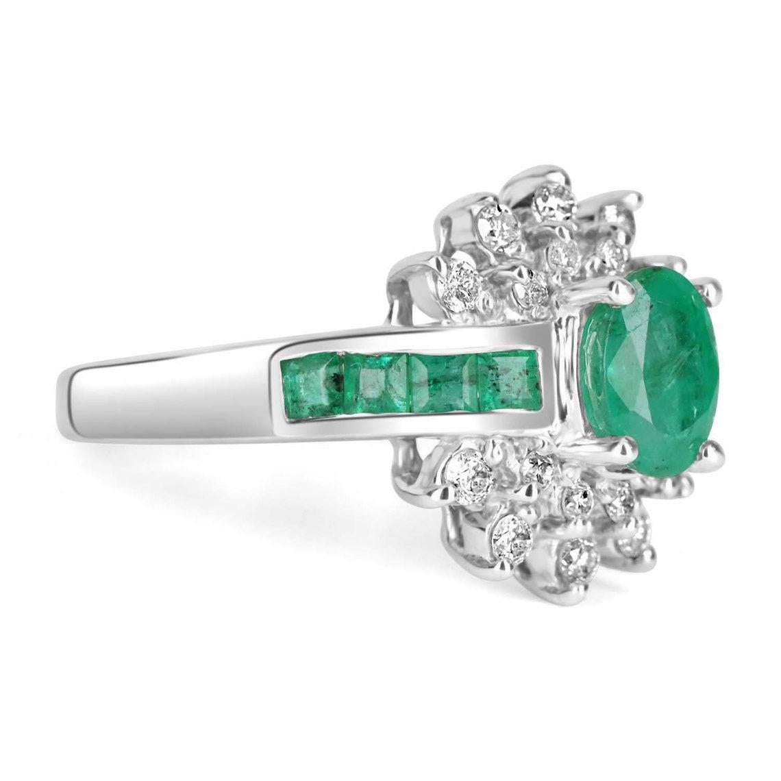 Displayed is a stunning, 1.98tcw Oval Colombian emerald and diamond ring solid 14K gold. This is a perfect emerald right-hand ring with a beautiful center stone. The center gem measures 7x5 and weighs an estimated 0.90+pts. Set in 14K white gold