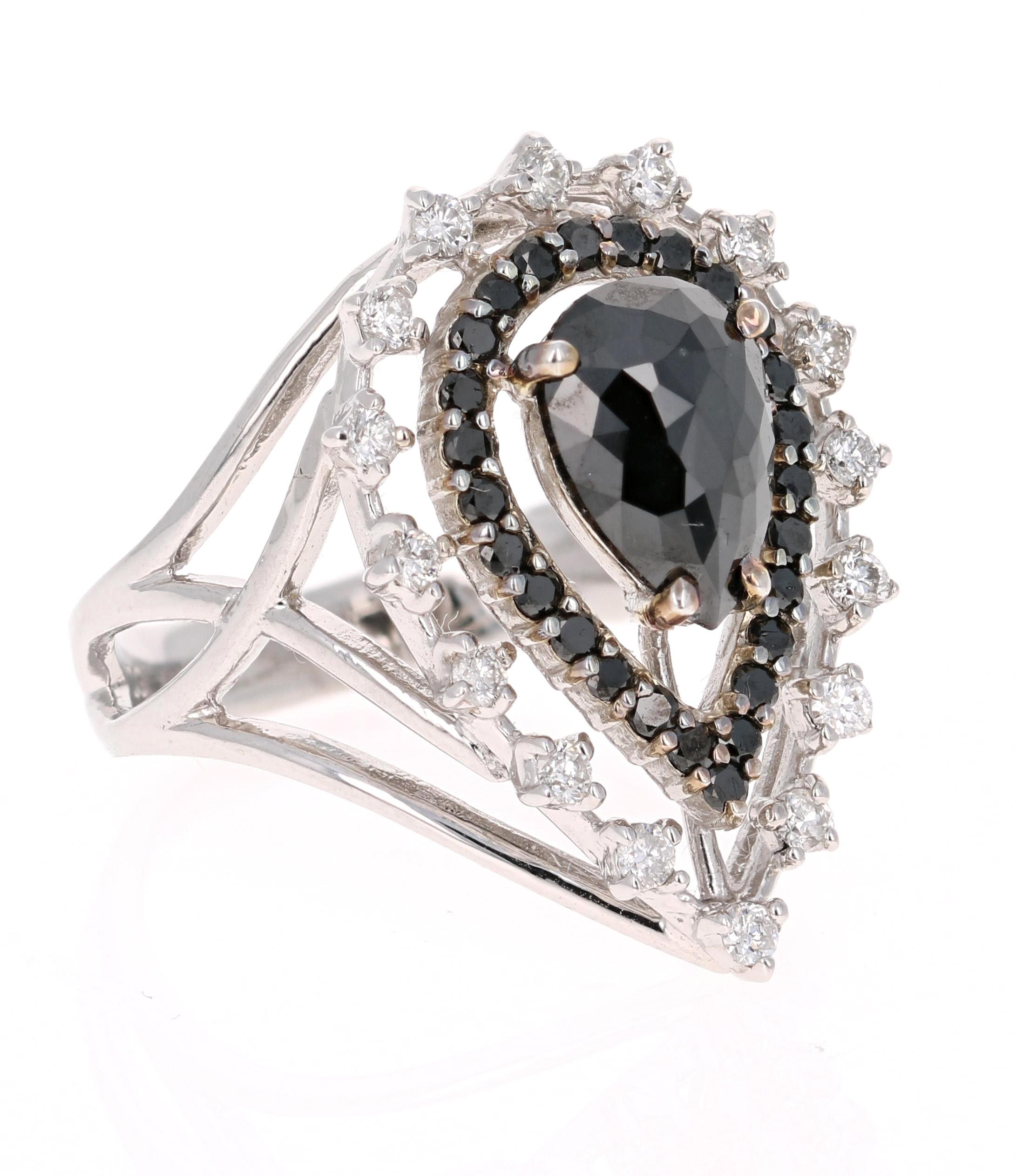 This Black and White Diamond Cocktail Ring is simply a Victorian Inspired Beauty! 

The Pear Cut Black Diamond is 1.31 Carats and is surrounded by a floating halo of 26 Black Round Cut Diamonds weighing 0.33 Carats. Additionally it has 16 Round Cut