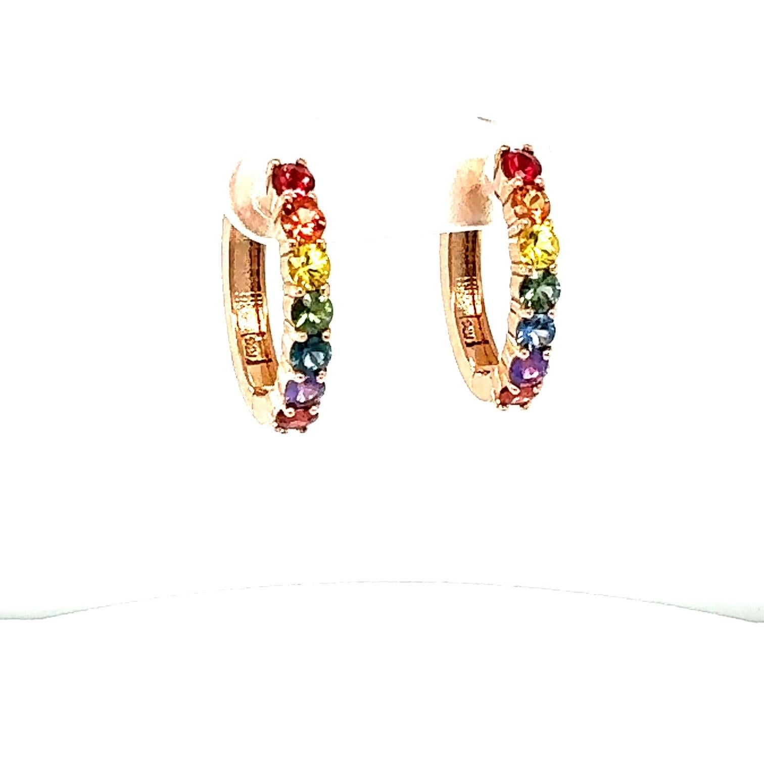 1.99 Carat Rainbow Sapphire Rose Gold Hoop Earrings
Beautiful Everyday Huggy Earrings 

Item Specs:

14 Round Cut Multi-Colored Natural Sapphires weighing 1.99 carats
Total Carat Weight is 1.99 carats
Crafted in 14K Rose Gold approximately 4.3