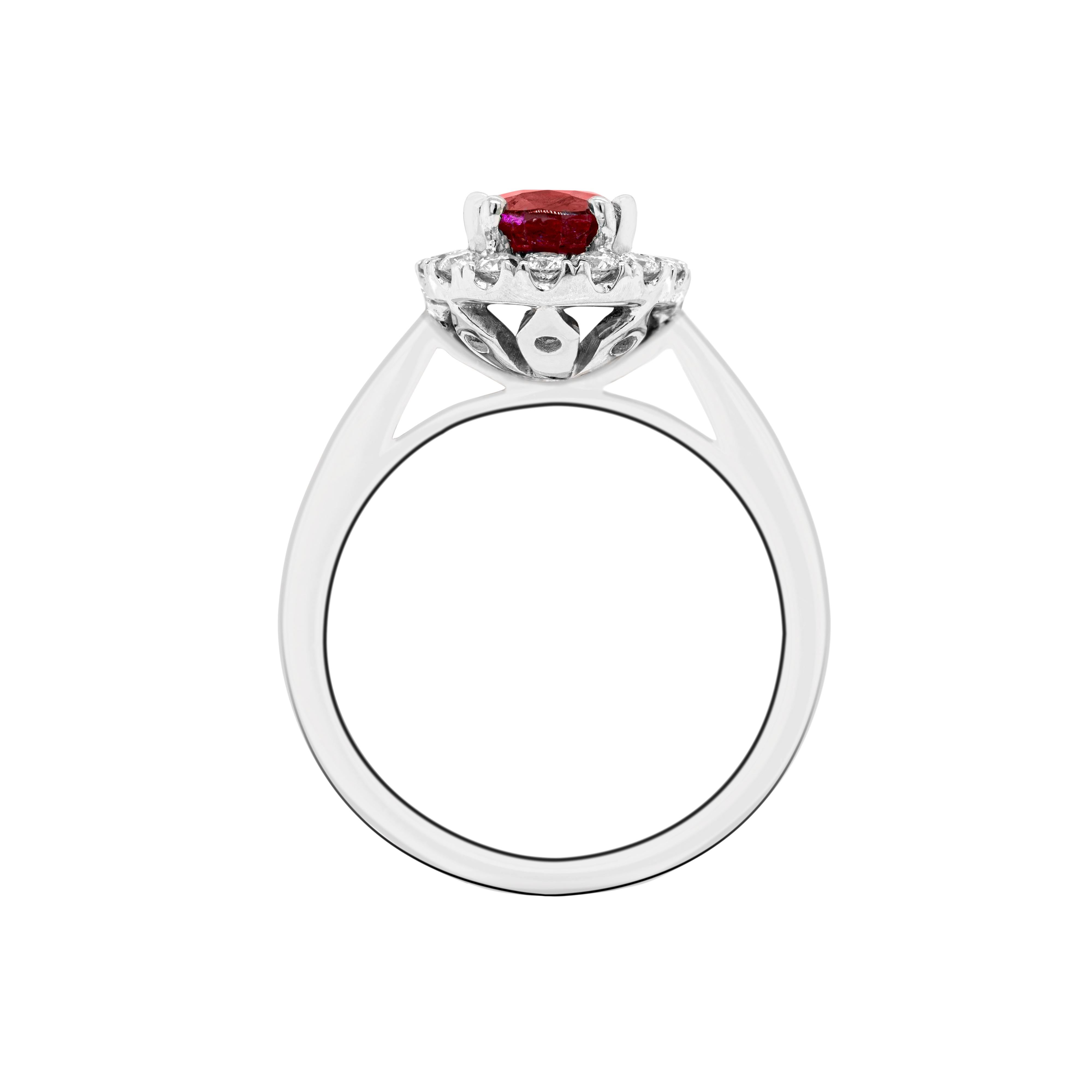 This beautiful engagement ring features a 1.99ct lively red oval shaped ruby mounted in an open back, four double claw setting. The gorgeous ruby is surrounded by a halo of 16 claw set fine round brilliant cut diamonds with a total weight of 0.28ct,