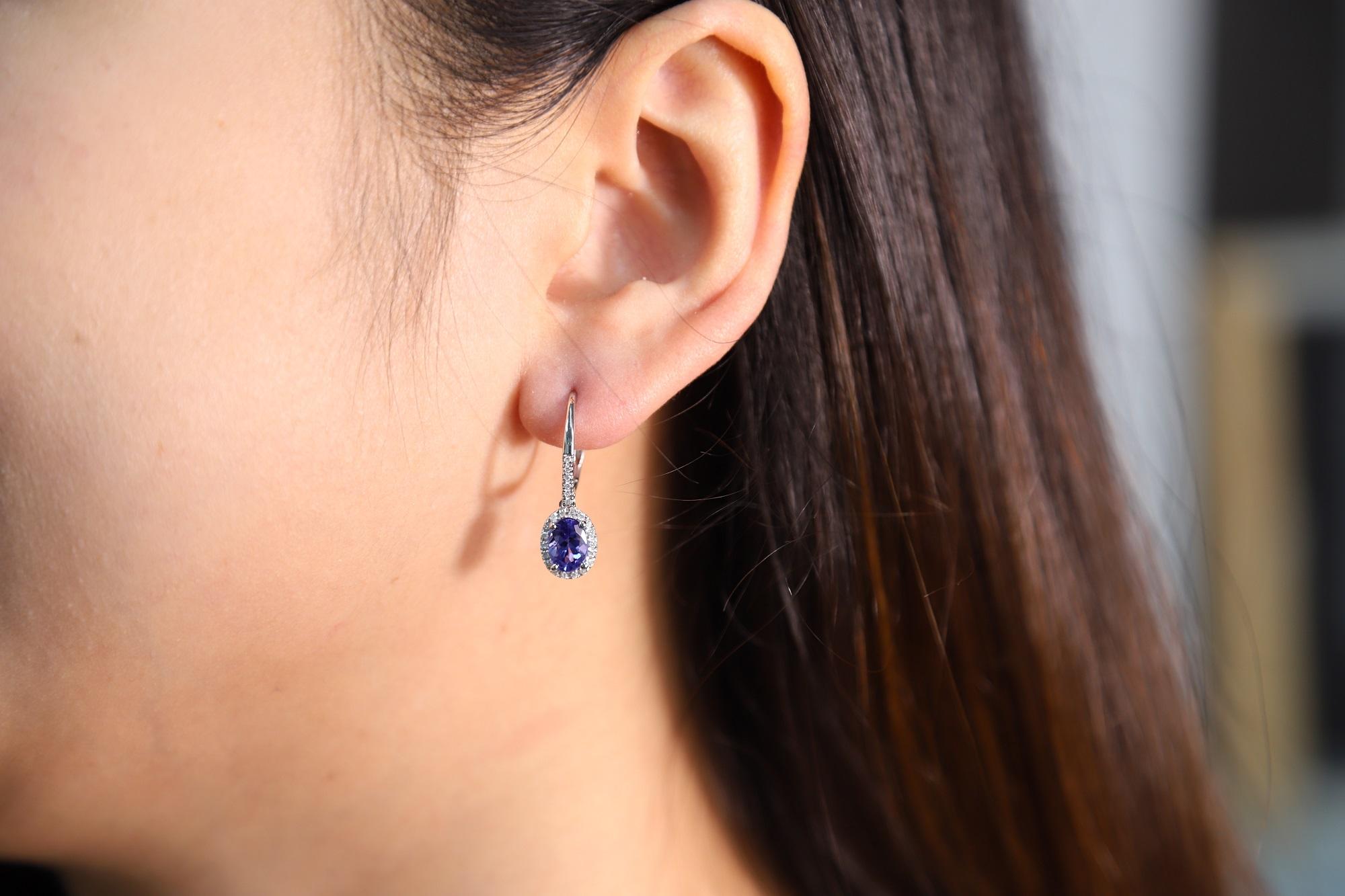 Stunning, timeless and classy eternity Unique Earring. Decorate yourself in luxury with this Gin & Grace Earring. The 14k White Gold jewelry boasts Oval-Cut Prong Setting Genuine Tanzanite (2 pcs) 1.99 Carat, along with Natural Round cut white