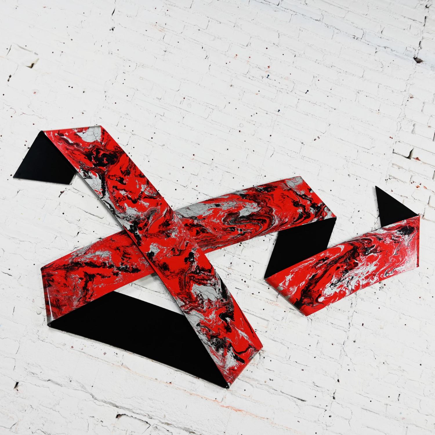 Phenomenal 1990 Abstract Richard Mann folded plexiglass Ribbon wall sculpture comprised of red, black, and metallic silver paint & powder. Beautiful condition, keeping in mind that this is vintage and not new so will have signs of use and wear even