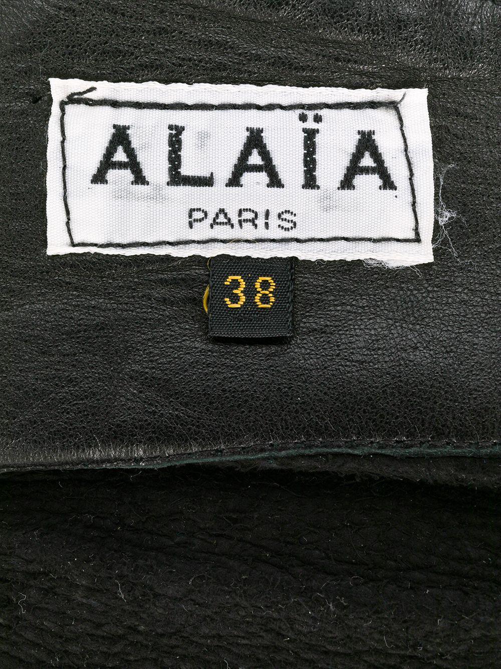 Azzedine Alaïa black soft lamb leather wide corset belt featuring center front pleats, a center back buckle, and an internal logo label. Circa 1990.
We attached some photos with the belt worn ( look grey but it is really black as per 1st photo)
In