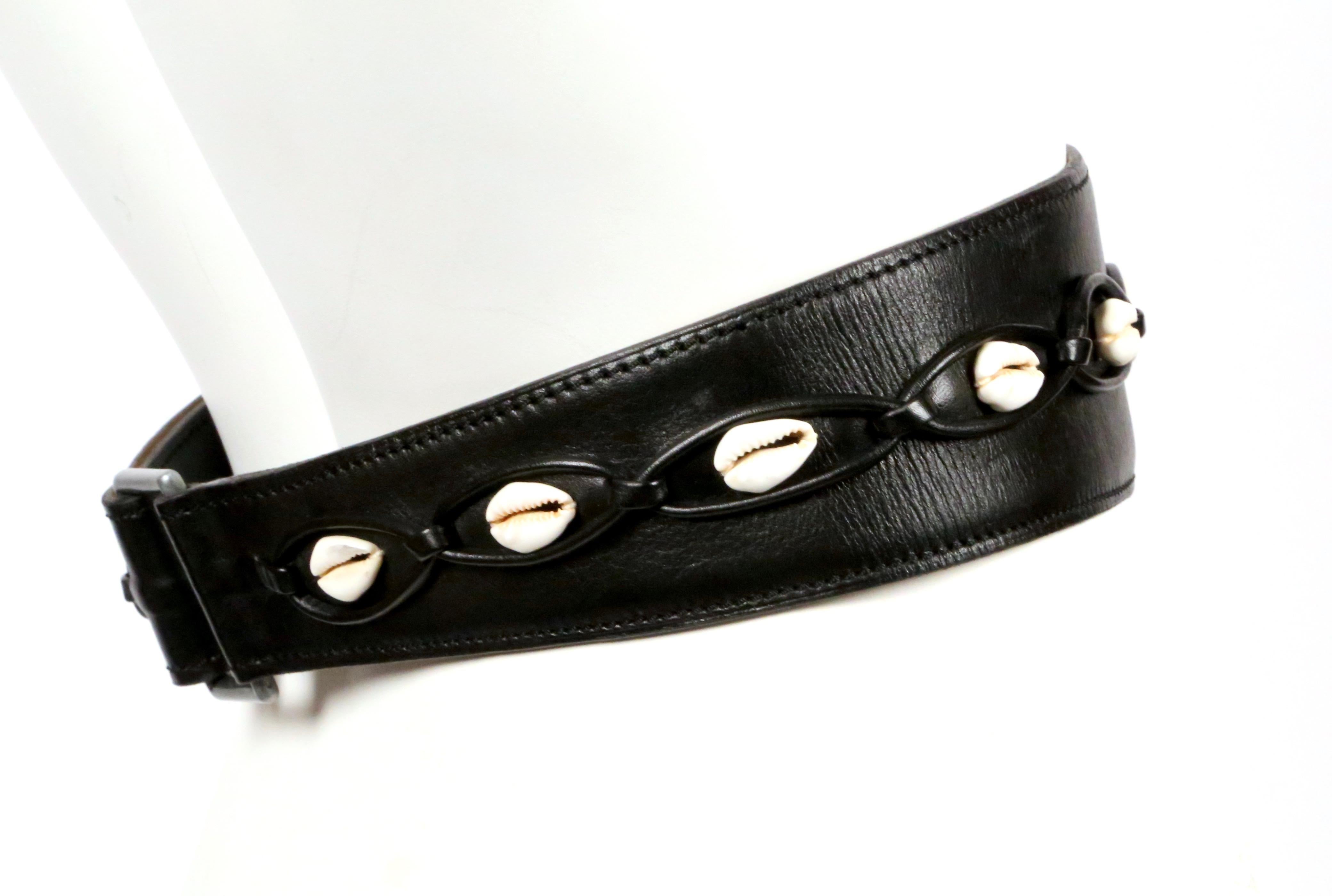 Very rare black leather belt with cowrie seashells and silver hardware from Azzedine Alaia dating to spring of 1990 exactly as seen on the runway. Labeled a french size 70, which best fits a US 2 to 6. Approximate measurements: width just under