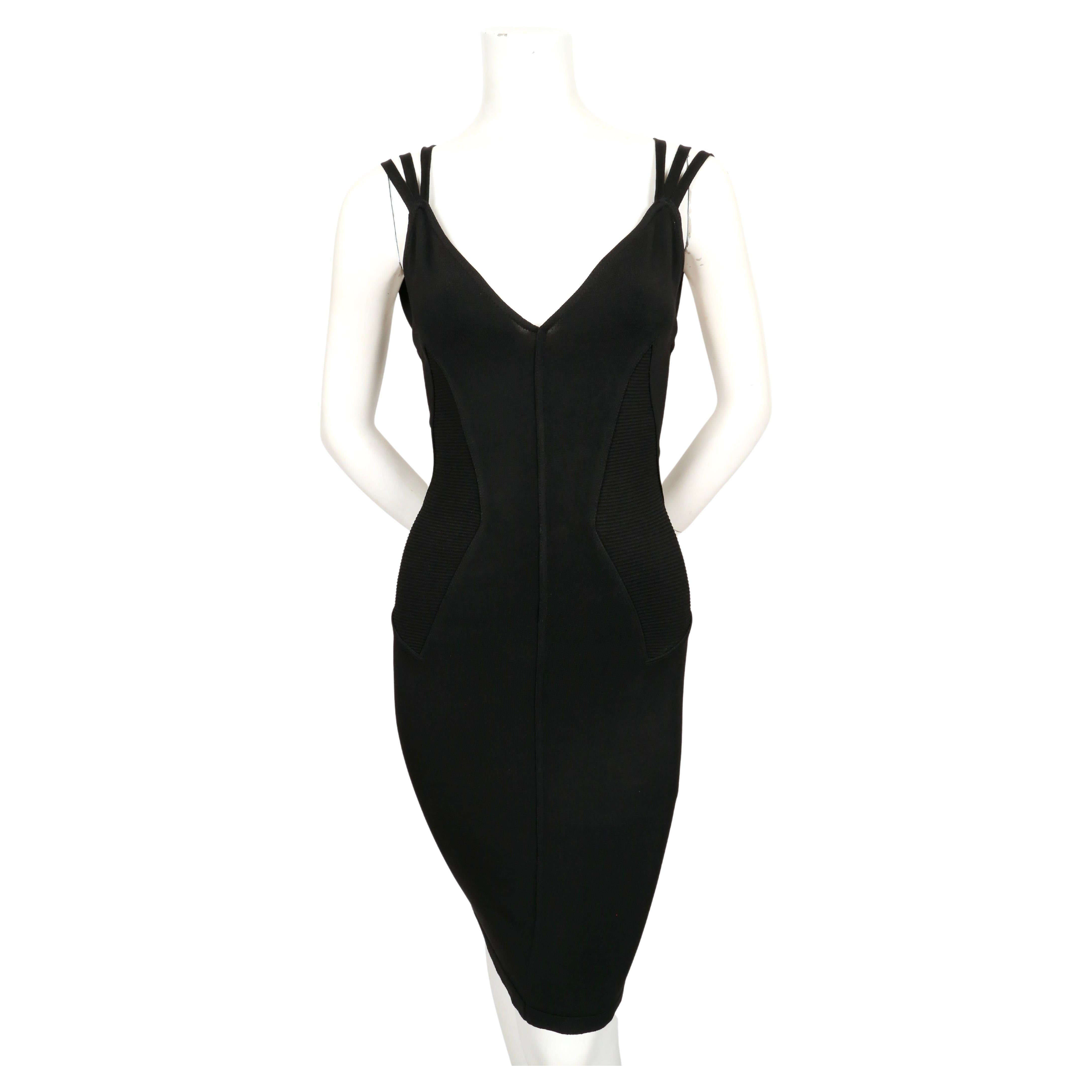 Jet-black knit dress with corseted waist and unique triple straps designed by Azzedine Alaia exactly as seen on the spring 1990 runway. Size XS.  Approximate measurements (unstretched): bust 30