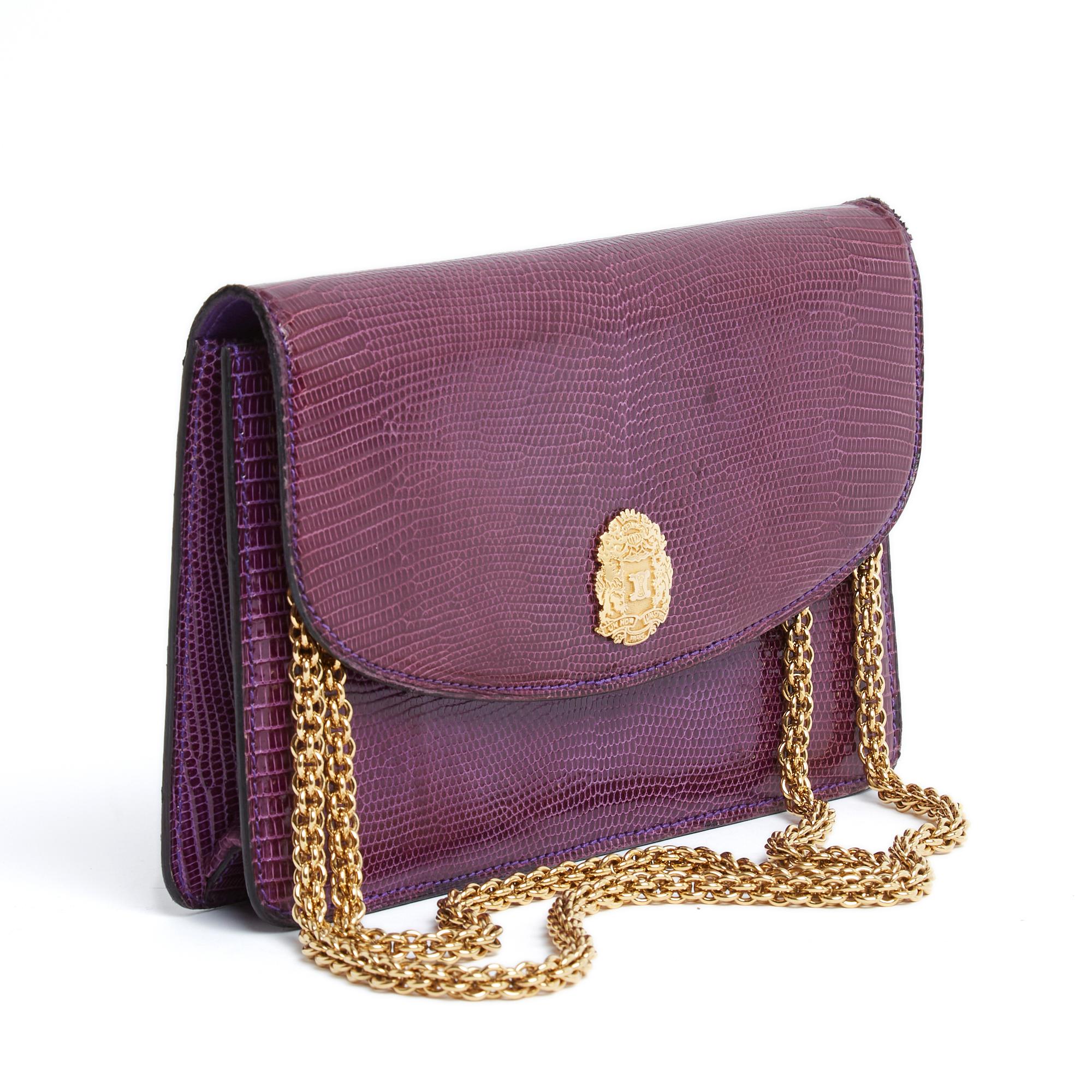 Céline bag or clutch circa 1990 in purple lizard leather, large flap closed with a snap under a gold metal piece with the Triomphe de Céline logo, interior in soft leather coordinated with a zipped pocket, removable gold metal chain (with logoed