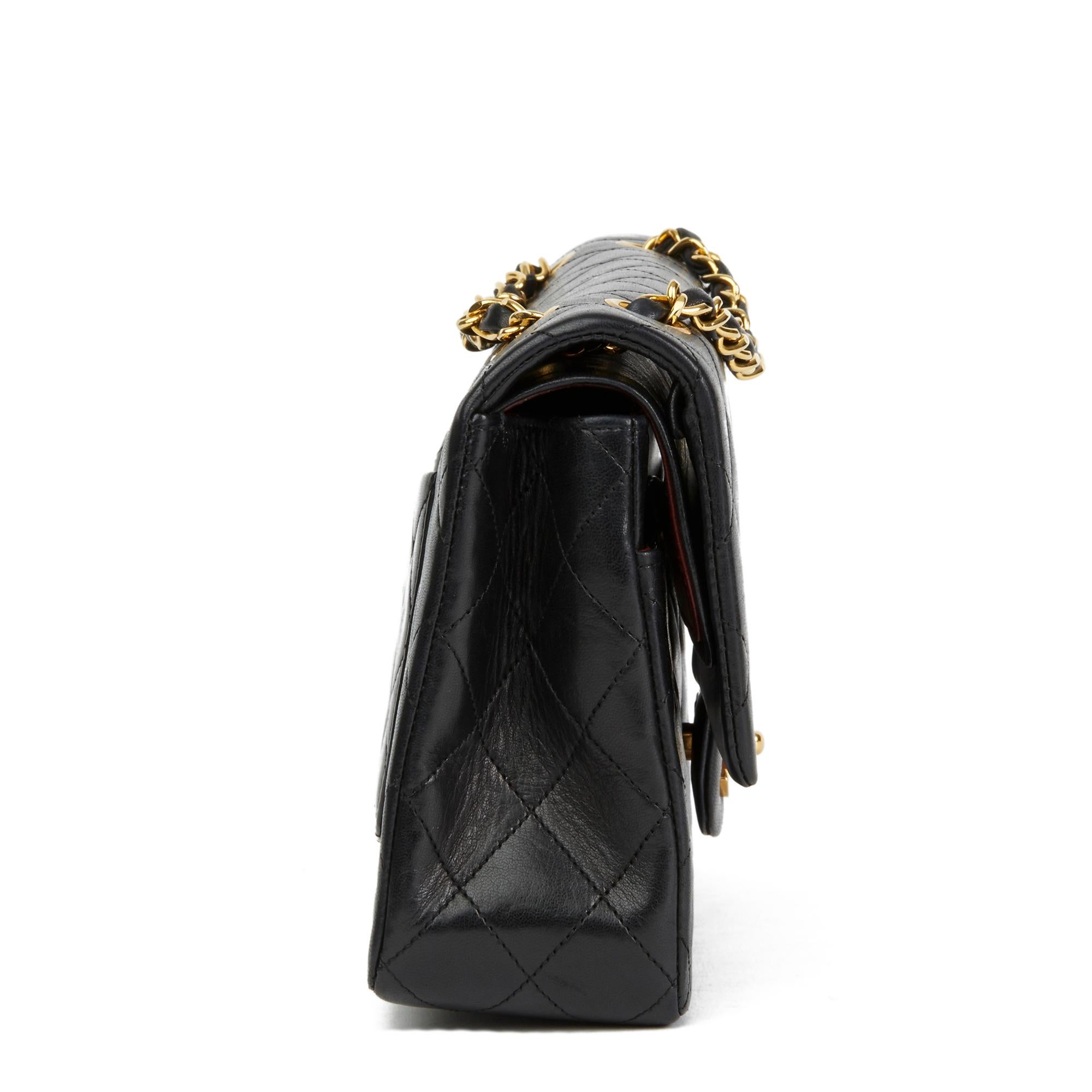 CHANEL
Black Quilted Lambskin Vintage Medium Classic Double Flap Bag

Reference: HB2776
Serial Number: 1700212
Age (Circa): 1990
Authenticity Details: Serial Sticker (Made in France)
Gender: Ladies
Type: Shoulder

Colour: Black
Hardware: Gold (24k