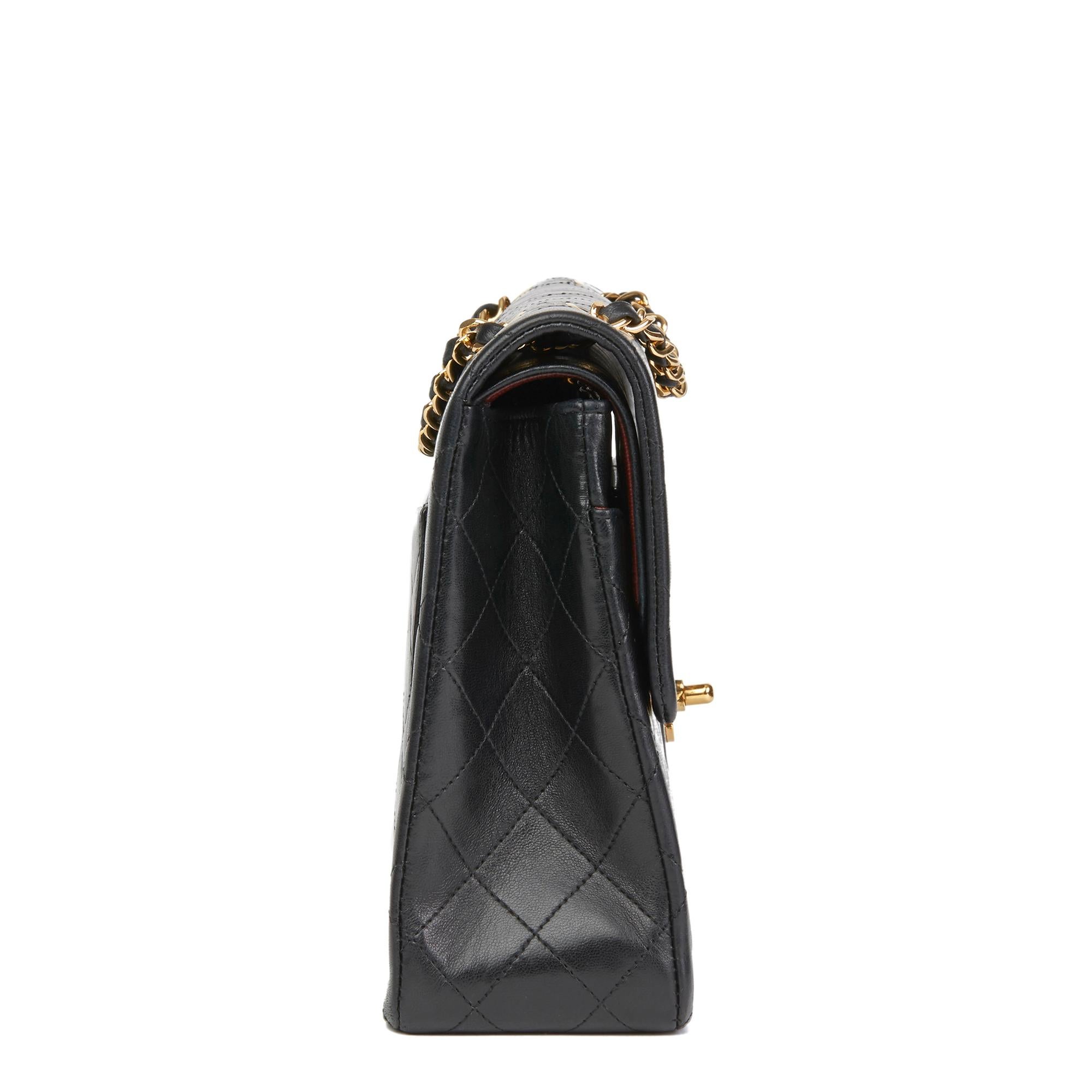 CHANEL
Black Quilted Lambskin Vintage Medium Tall Classic Double Flap Bag

Reference: HB2712
Serial Number: 1178622
Age (Circa): 1990
Accompanied By: Chanel Dust Bag
Authenticity Details: Serial Sticker (Made in France)
Gender: Ladies
Type: