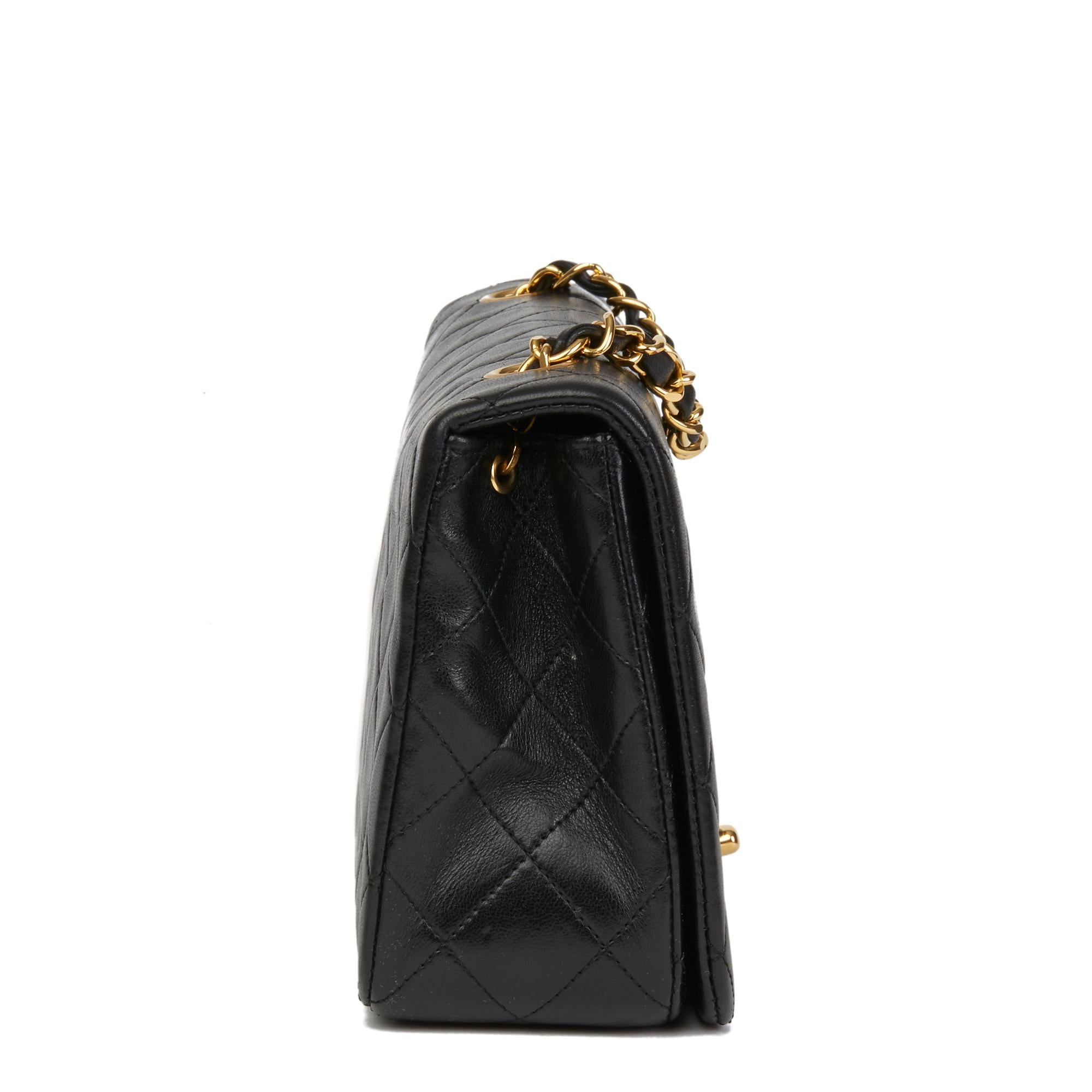 CHANEL
Black Quilted Lambskin Vintage Small Classic Single Full Flap Bag

Reference: HB2697
Serial Number: 1470296
Age (Circa): 1990
Accompanied By: Chanel Dust Bag, Box, Authenticity Card
Authenticity Details: Serial Sticker, Authenticity Card