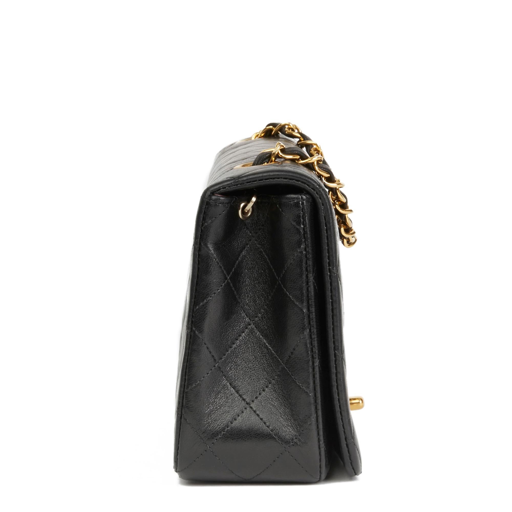 CHANEL
Black Quilted Lambskin Vintage Small Classic Single Full Flap Bag

Reference: HB2748
Serial Number: 1469104
Age (Circa): 1990
Accompanied By: Chanel Dust Bag
Authenticity Details: Serial Sticker (Made in France)
Gender: Ladies
Type: Shoulder,