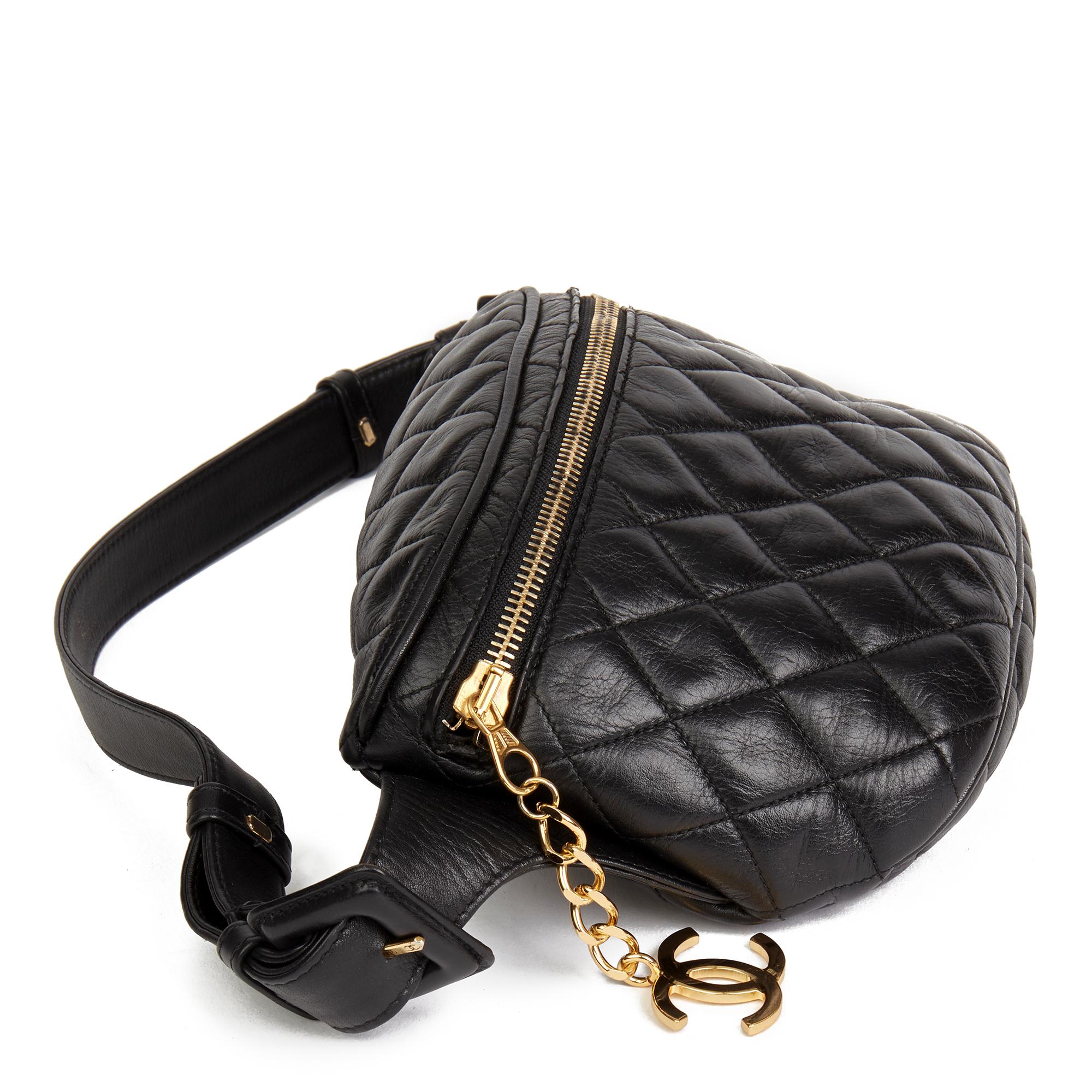 CHANEL
Black Quilted Lambskin Vintage Timeless Belt Pouch

 Reference: HB2474
Age (Circa): 1990
Authenticity Details: (Made in France)
Gender: Ladies
Type: Belt Bag, Accessory

Colour: Black
Hardware: Gold
Material(s): Lambskin Leather
Interior: