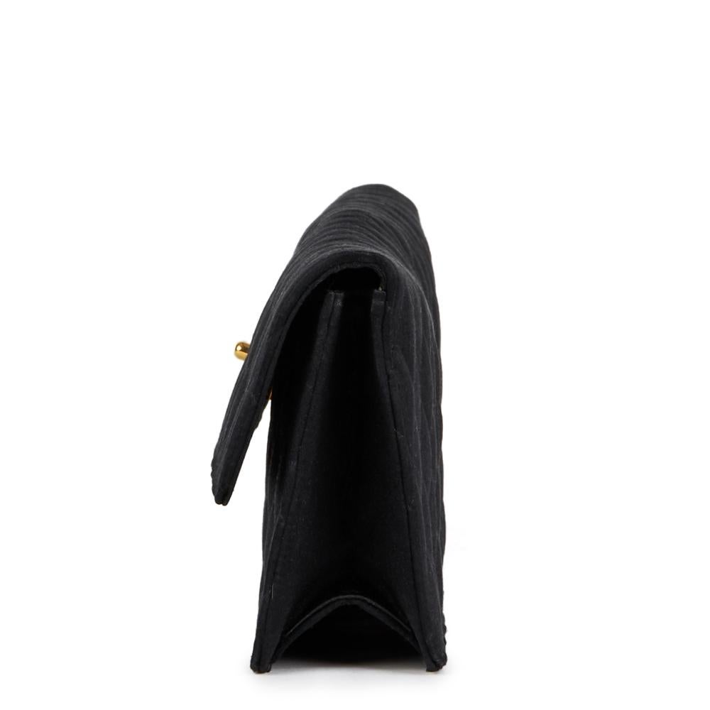CHANEL
Black Quilted Satin Vintage Extra Long Classic Clutch

Reference: HB2406
Serial Number: 1613983
Age (Circa): 1990
Accompanied By: Authenticity Card
Authenticity Details: Serial Sticker, Authenticity Card (Made in France)
Gender: Ladies
Type: