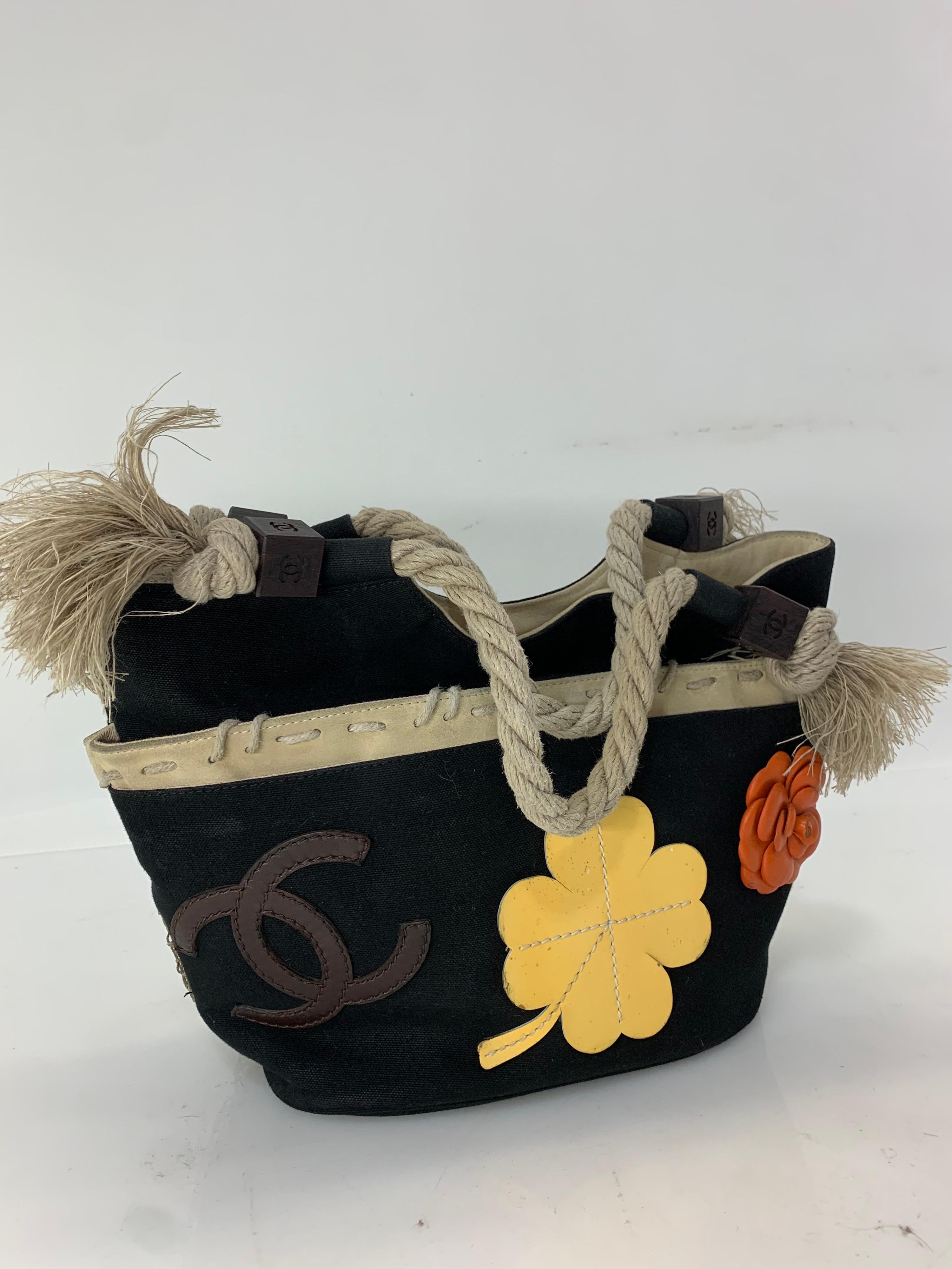 1990s Chanel Spring/Summer Collection black cotton canvas tote bag with colorful leather appliques of camellia, clover and 