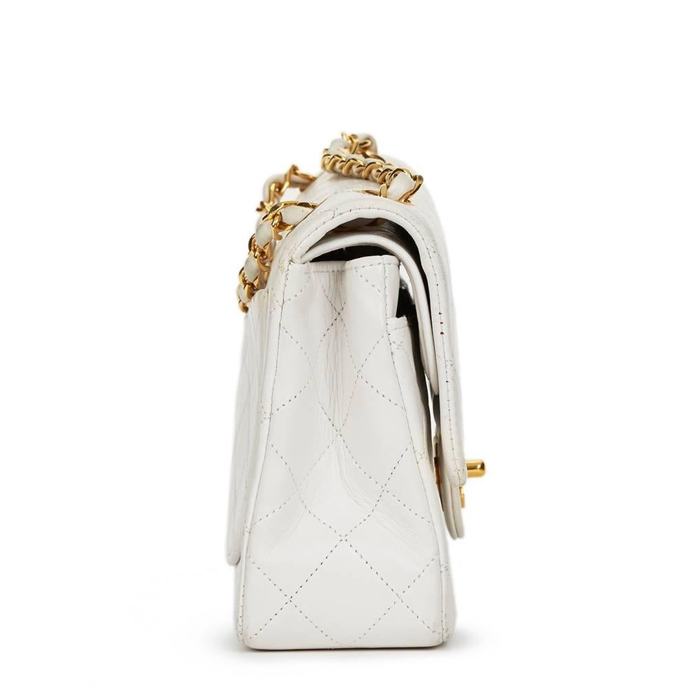 CHANEL
White Quilted Lambskin Vintage Small Classic Double Flap Bag

Reference: HB1328
Serial Number: 1692217
Age (Circa): 1990
Accompanied By: Chanel Dust Bag, Authenticity Card
Authenticity Details: Authenticity Card, Serial Sticker (Made in