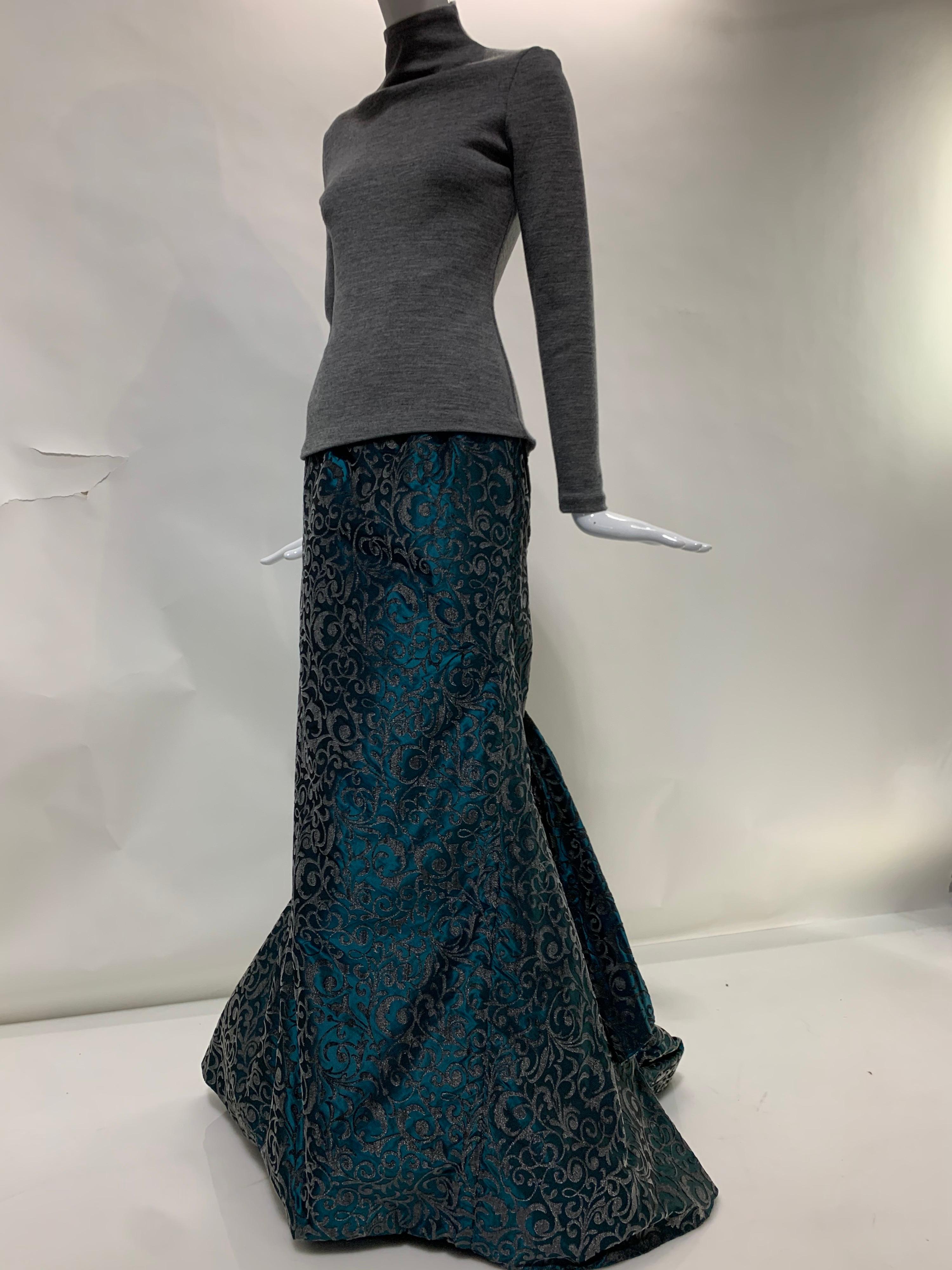 1990s Michael Casey Couture 2-piece ensemble consisting of a grey high neck knit sweater with long sleeves and back zipper and a floral flocked teal silk taffeta formal skirt, caught up in a low bubble train at the back of the knees and supported by