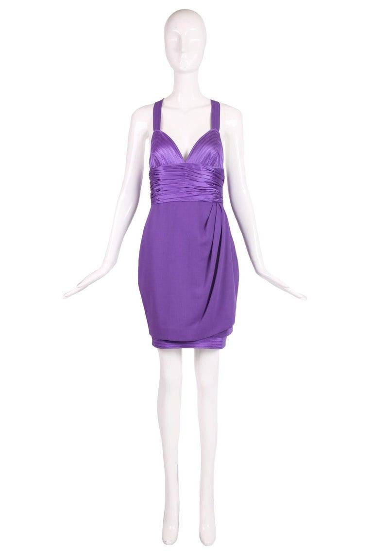 1990 F/W Gianni Versace couture purple wool faux-wrap mini dress with criss-crossing straps at the back and purple silk design elements: a silk ruched waistband, silk overstitched bustier/bodice and an interior silk lined skirt featuring a silk