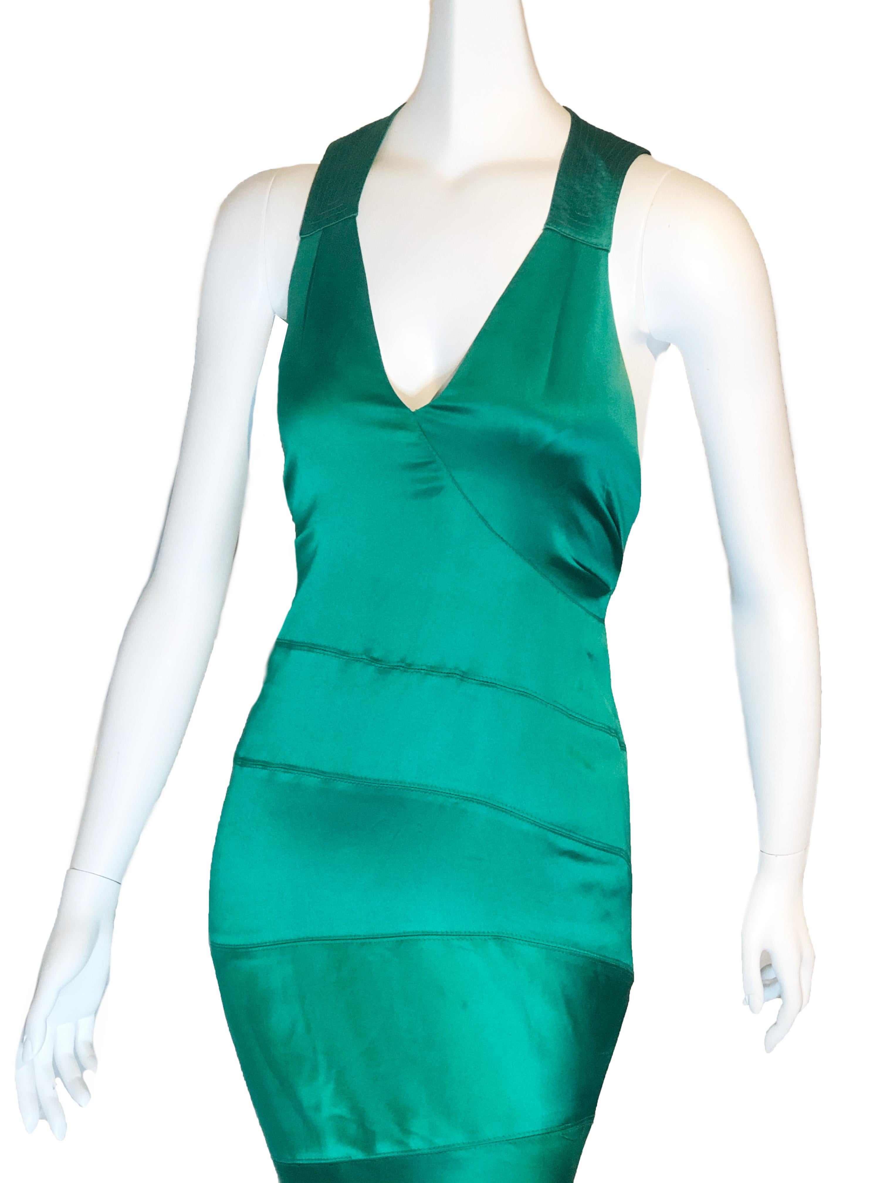 1990s Gianni Versace emerald green silk satin bias cut gown with clever seaming and trapunto stitched racer-back yolk. Fishtail flared hem. Marked Italian size 40. Classic.
Condition
BC. Good. Small discolored spots in places. Slight discoloration