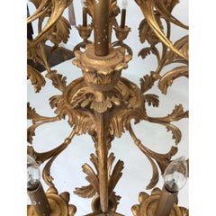 1990 Italian 24-Light Hand Carved Wood Chandelier in Distressed Gold Leaf Finish