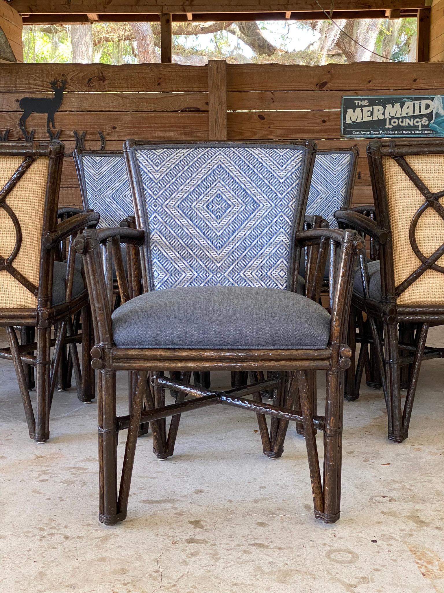 Introducing a fabulous set of eight faux Bois rattan armchairs, custom made by McGuire for an exclusive club in Florida. These elegant chairs feature a distinctive target back design, exuding a timeless charm and sophistication.

While these chairs