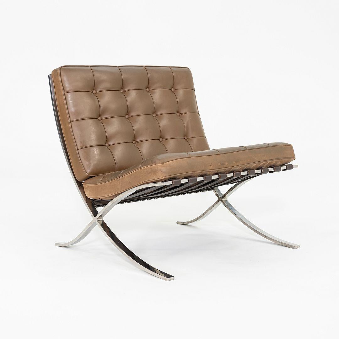This is a Barcelona Lounge Chair, model 250LS, initially designed by Mies van der Rohe and Lilly Reich in 1929. This example was produced by Knoll in the United States in 1990. It features a solid, hand-polished stainless-steel frame (vs. the more