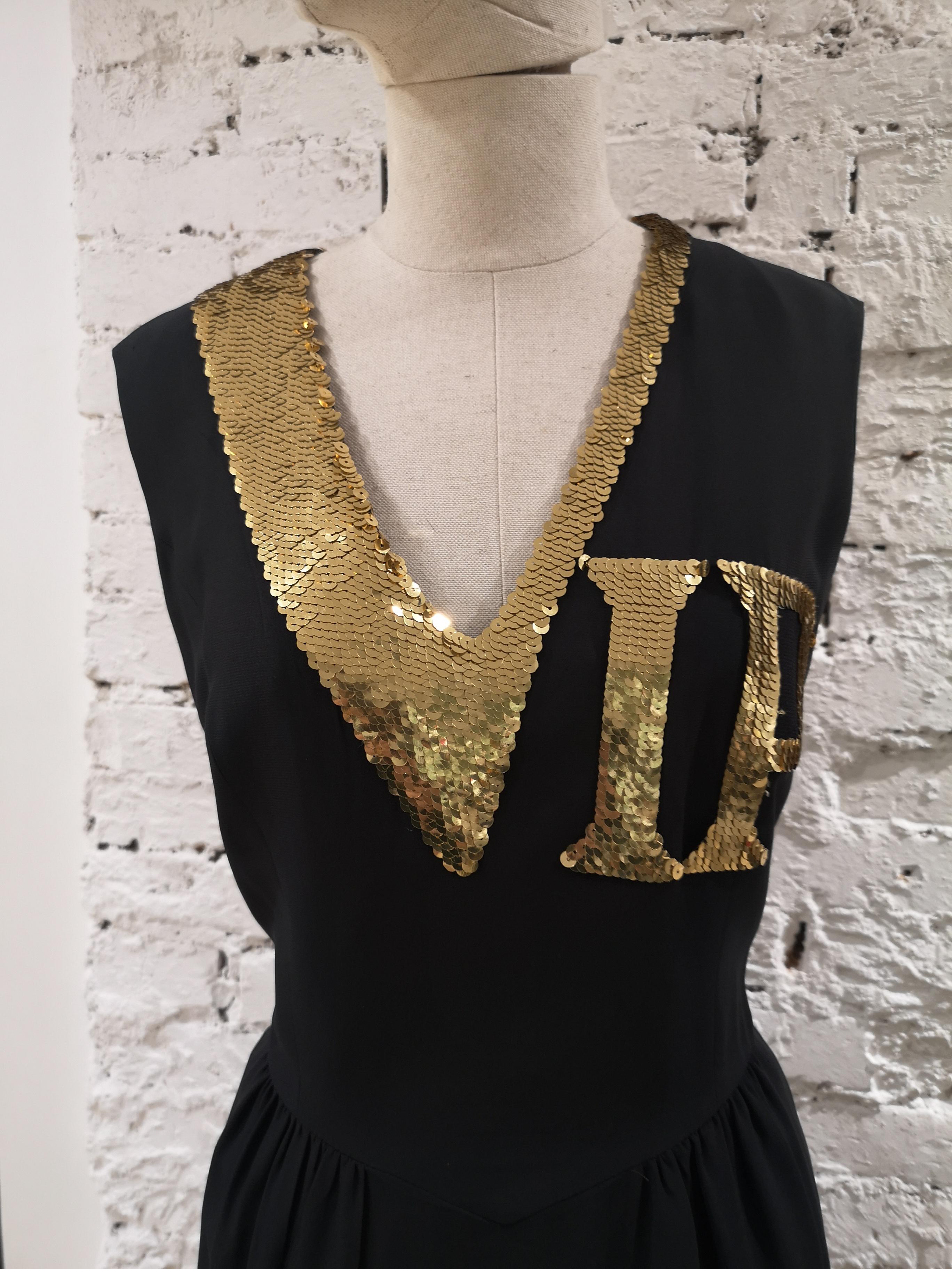 Moschino Gold sequins VIP Dress
VIP dress by Franco Moschino, one of Moschino's most iconic designs. 
black dress with gold sequin 
