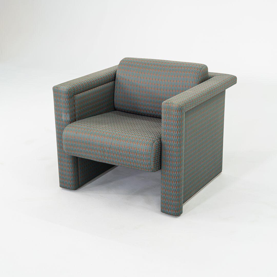 This is a pair of Upholstered Club Chairs from 'The Lounge Seating' series, designed by the Swiss husband-and-wife design duo Robert and Trix Haussmann for Knoll International in 1988. This pair of chairs dates to 1990, and we have two sets of pairs