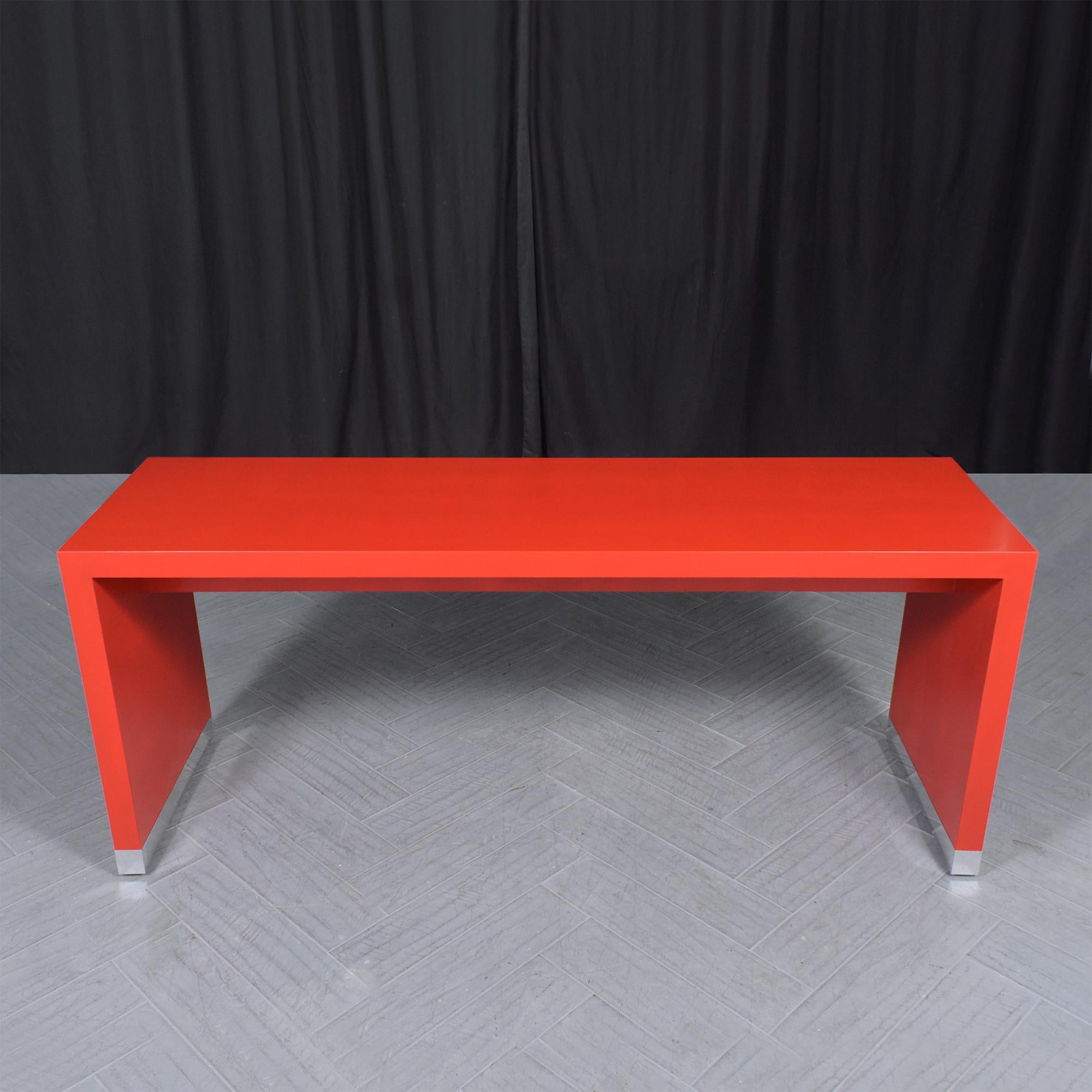 Immerse yourself in the allure of our mid-century modern sofa console, a striking piece that brings the vibrancy of 1990 back to life. Expertly restored by our skilled craftsmen, this substantial console table is a testament to meticulous