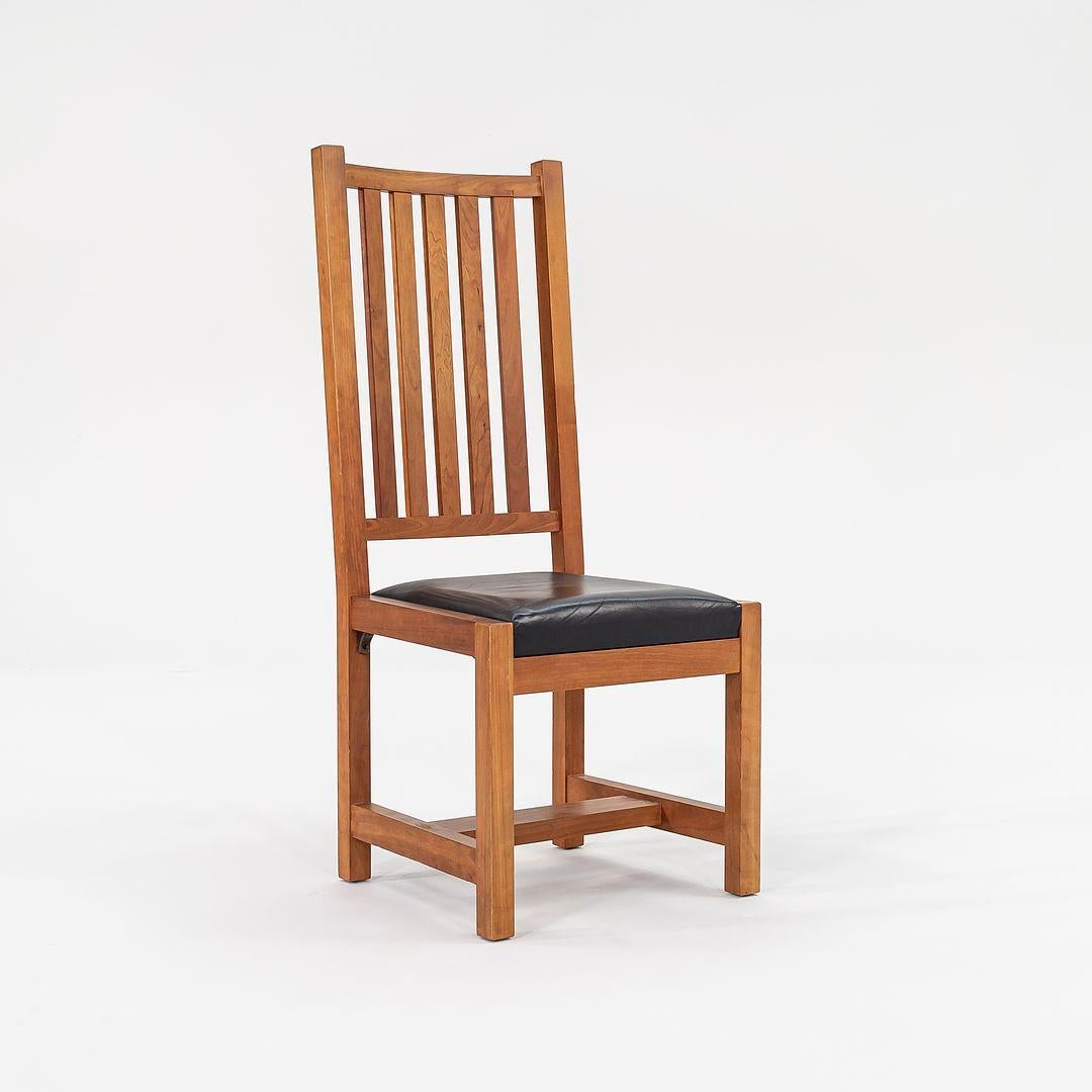 These are large scale Mission-Style Dining Chairs, designed by Thomas Moser in the USA. The listed price includes one chair, and we have several available for purchase. These came to us from a university library setting. They are crafted from solid