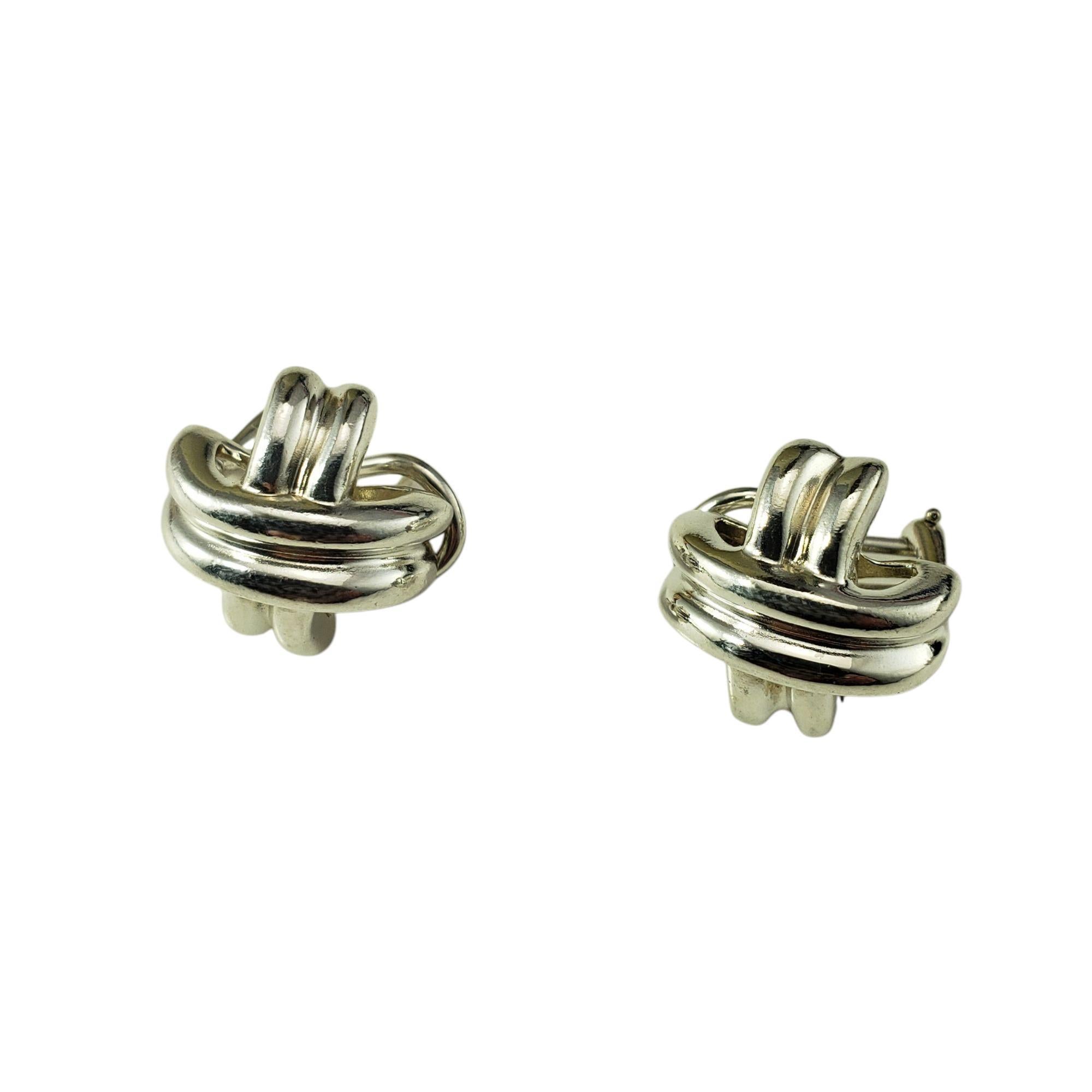 Tiffany & Co. Sterling Silver Signature Cross X Earrings-

Classic and refined, these Tiffany & Co. earrings are crafted in gleaming sterling silver, showcasing the brand's timeless elegance. Featuring a sculpted cross design with smooth, clean