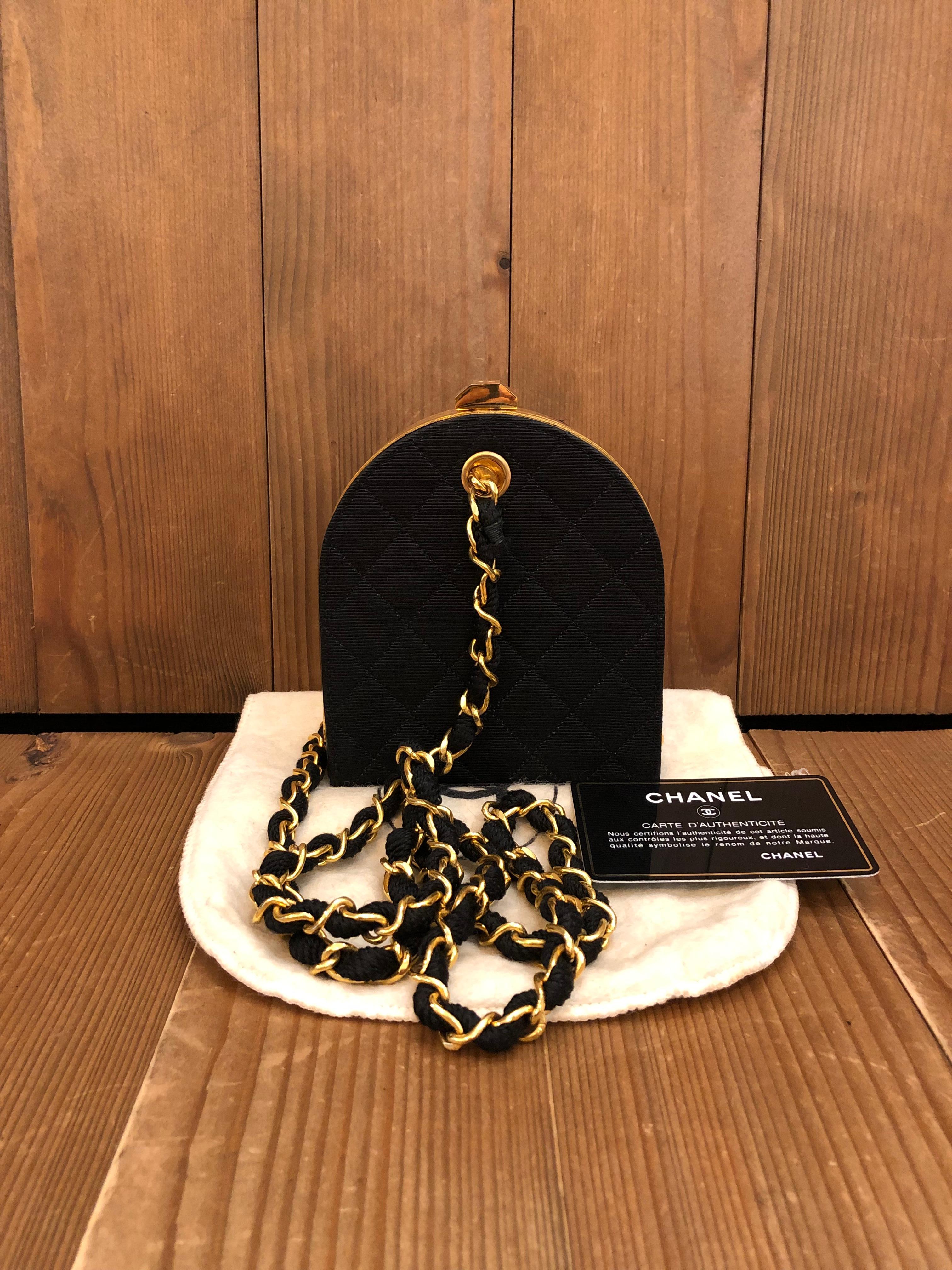 This vintage Chanel mini box clutch bag is crafted of diamond quilted canvas and lambskin leather in black with gold toned hardware. The clutch features gold toned chain interlaced with the same canvas. The bottom part of the clutch is lined with
