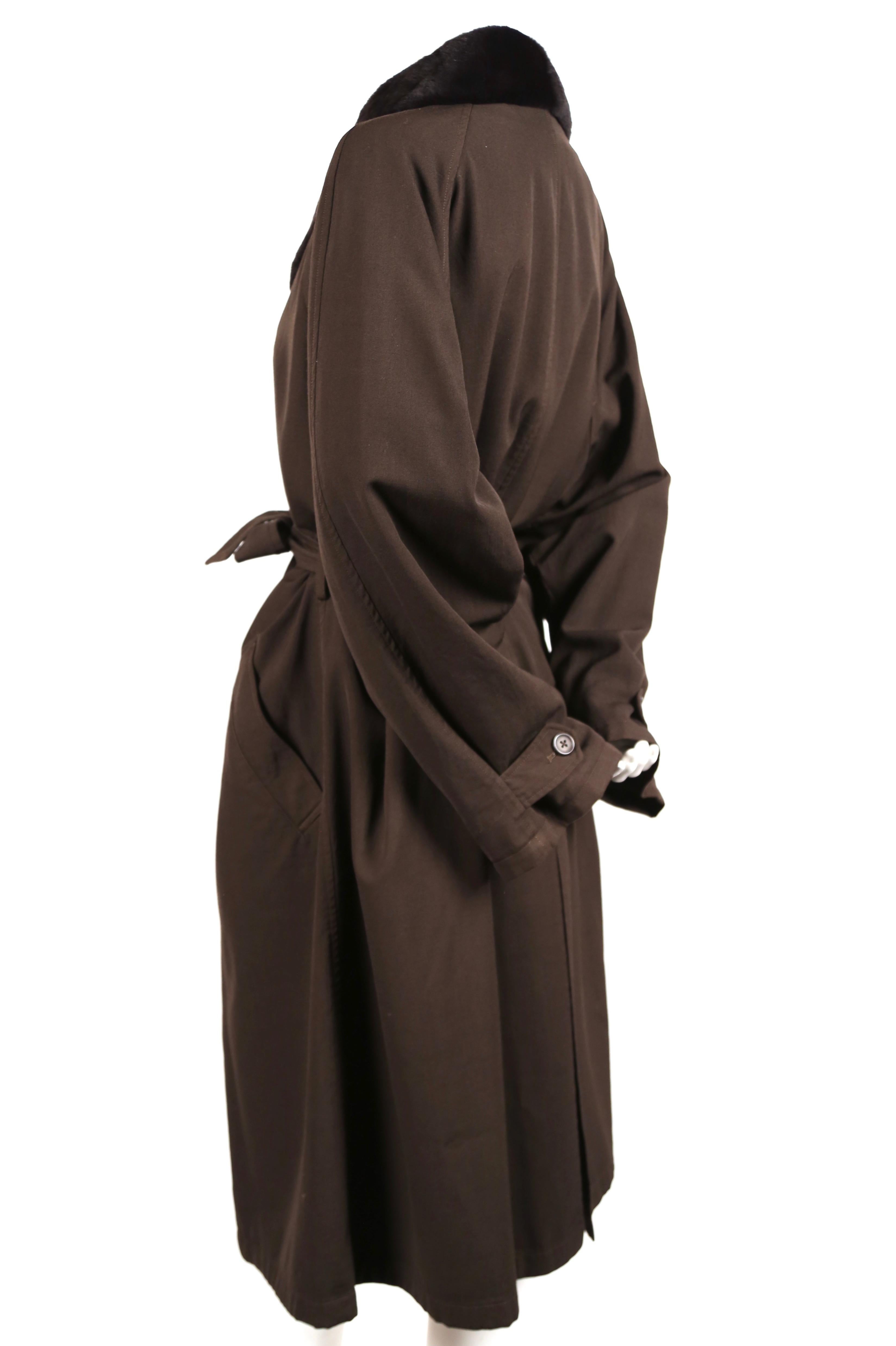 Brown wool trench with removable mink collar designed by Yohji Yamamoto for men dating to the 1990's. Although this coat is oversized, it can be worn by both men and women. Men's size M (photographed on a size 2 mannequin). Approximate measurements: