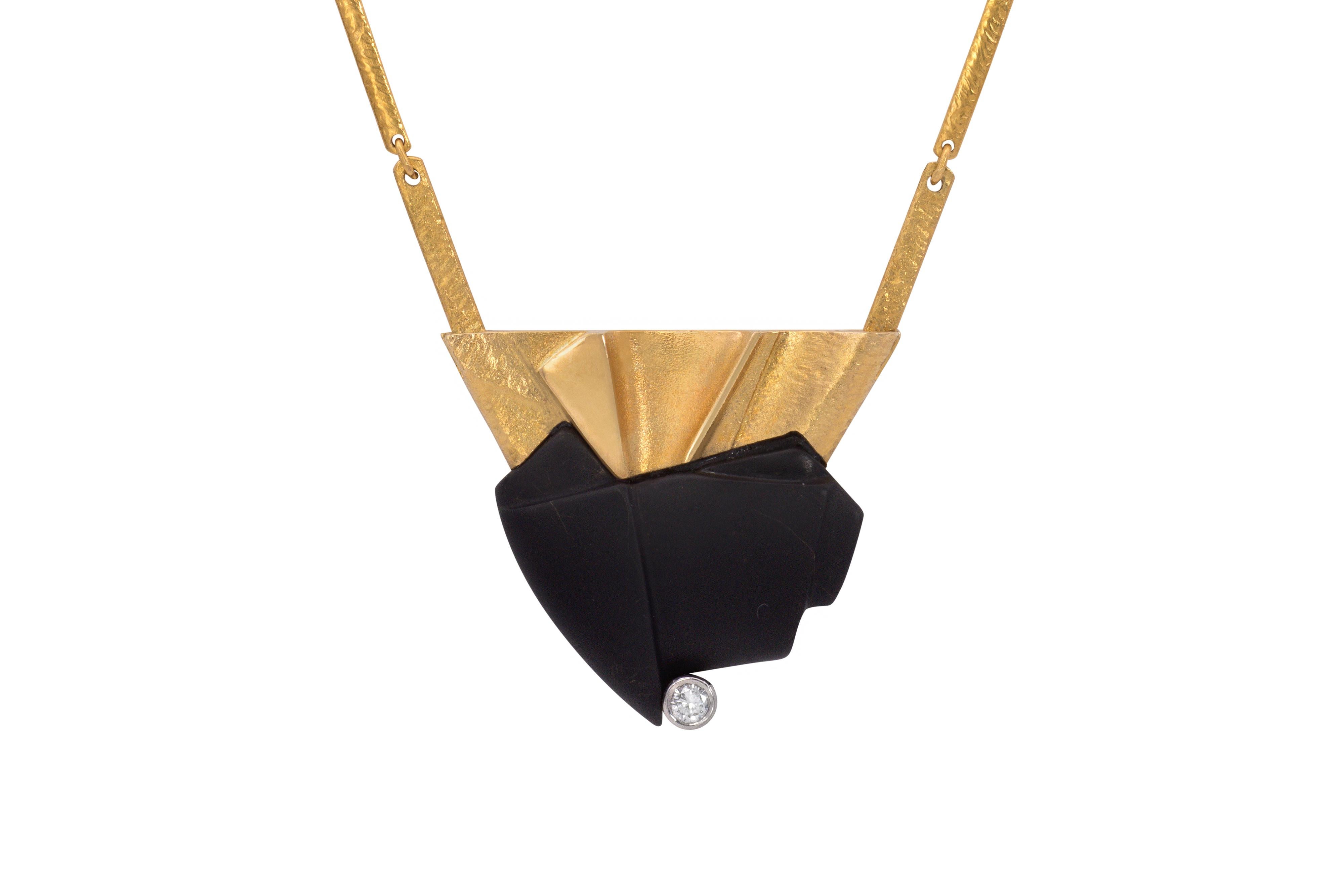 An onyx, diamond, and 18 karat gold necklace, by Zoltan Popovitz, for Lapponia 1990. The necklace is stamped with Finnish hallmarks, maker's mark, 750, and date mark for 1990. 

The hand-textured chain is 16.50