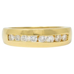 1990's 0.48 CTW Diamond 14 Karat Yellow Gold Vintage Channel Band Ring