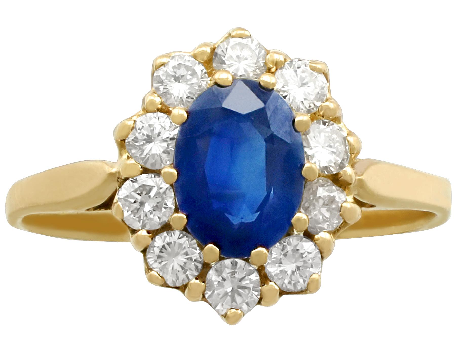 A fine and impressive 1.05 carat natural blue sapphire and 0.46 carat diamond, 18k yellow gold cluster / dress ring; part of our diverse vintage jewellery and estate jewelry collections

This fine and impressive vintage sapphire cluster ring has