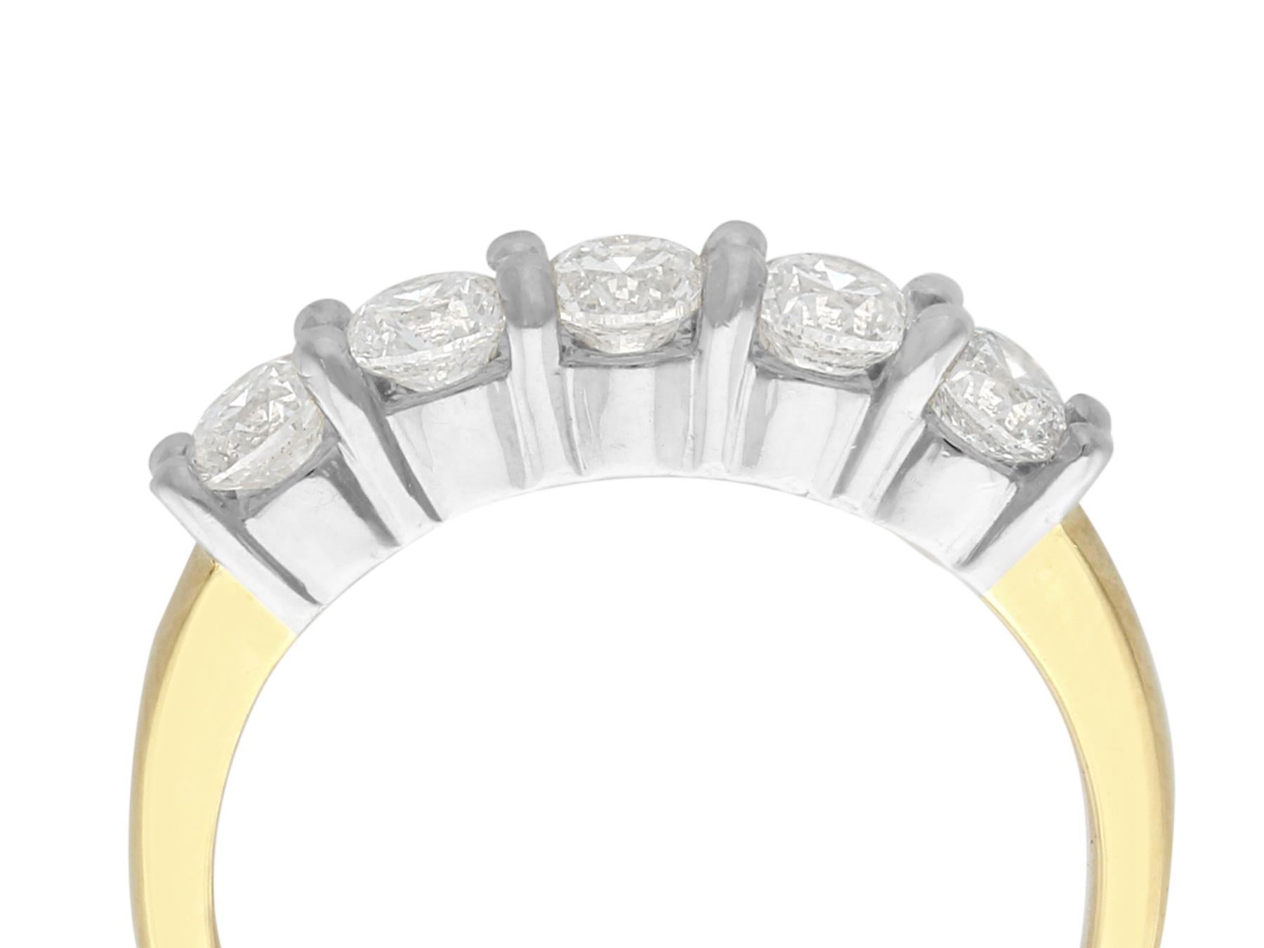 This fine vintage diamond half eternity ring has been crafted in 14k yellow gold with a 14k white gold setting.

The substantial 14k white gold mount displays five claw set modern brilliant round cut diamonds.

The subtly flared ring shoulders blend