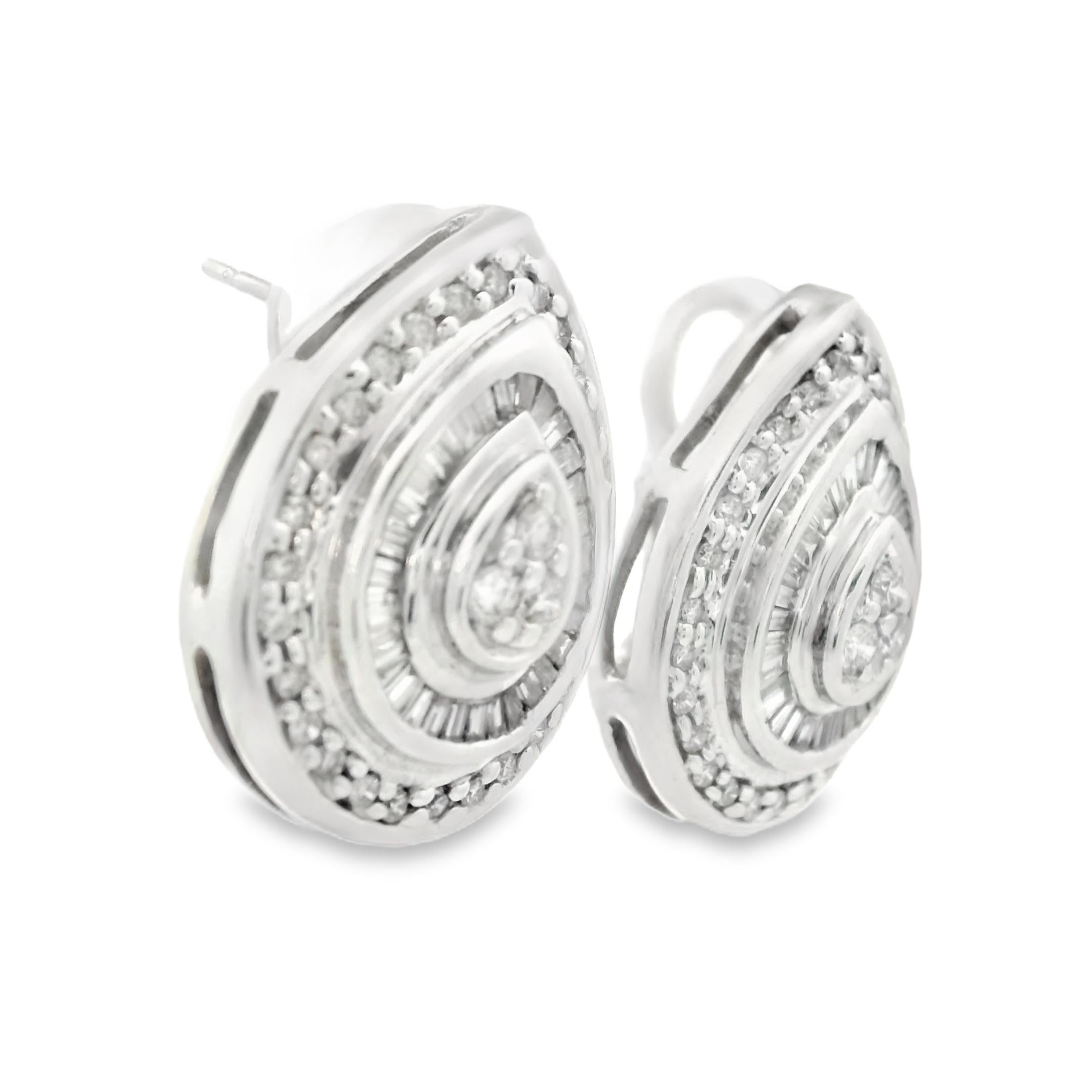 This incredible pair of earrings comes from the 1990s, made with 14k white gold, round and baguette diamonds. They feature a leverback design and a classic teardrop/pear shape. Can you imagine wearing these to your next formal event? These earrings