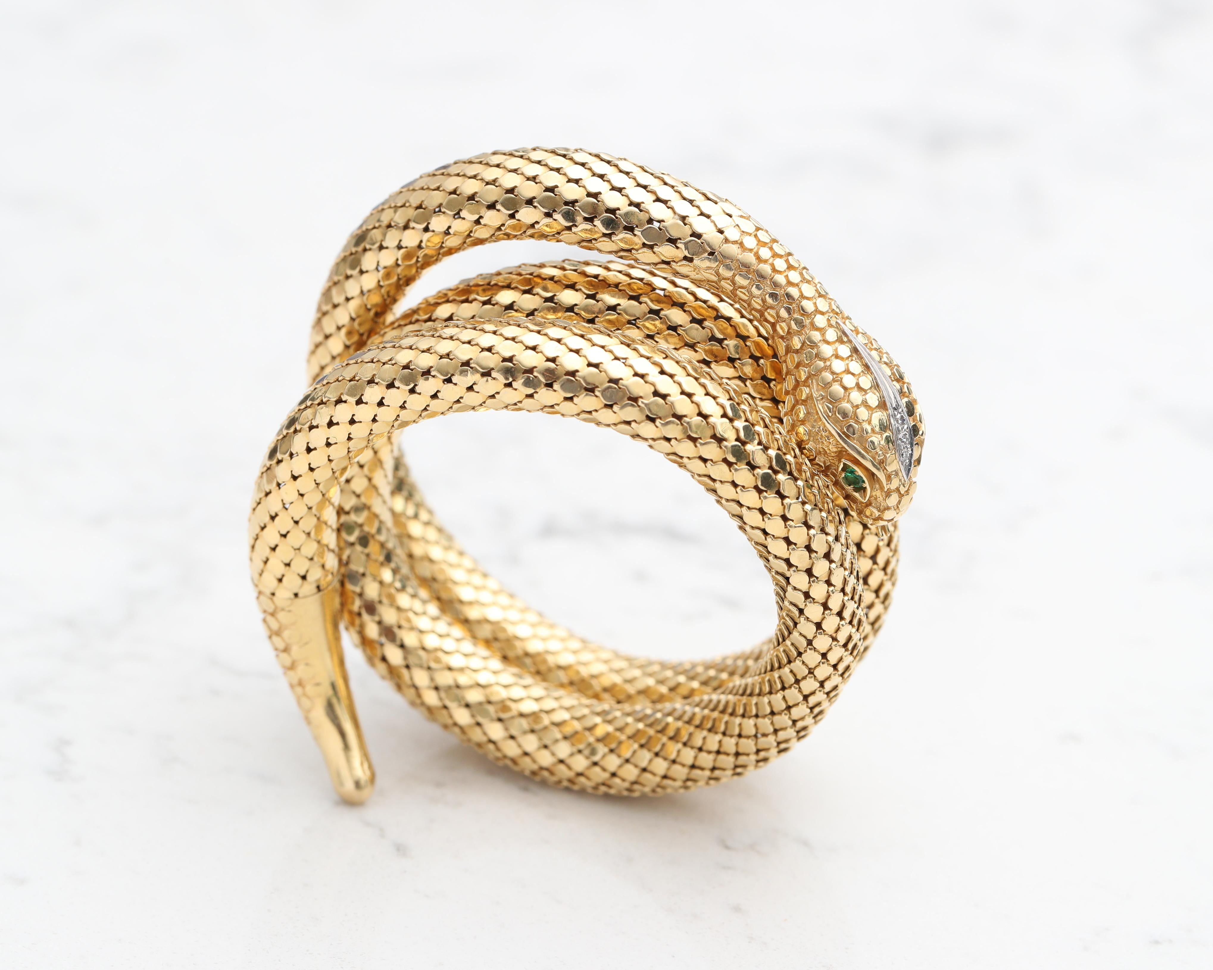 1990s 18 Karat Yellow Gold Serpent Bangle Bracelet

Emerald Gemstones are the Eyes and Accent Diamonds are placed on the edge of the eyes and on the head. 

Extremely well made bangle with strong 18 karat gold that stands out. 

Incredibly flexible