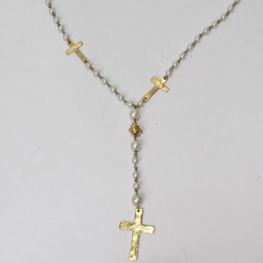 This 1990s lariat rosary necklace is the perfect timeless piece of jewelry to add to your collection! Classic rosary style lariat necklace features faux pearls and three 18K gold plated crosses alongside gold plated detailing. This is such a