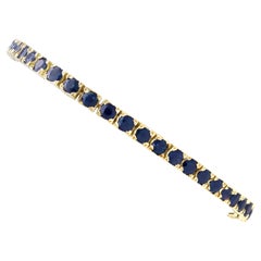 Retro 1990s 6.90 carat Sapphire Tennis Bracelet in 14k Yellow Gold